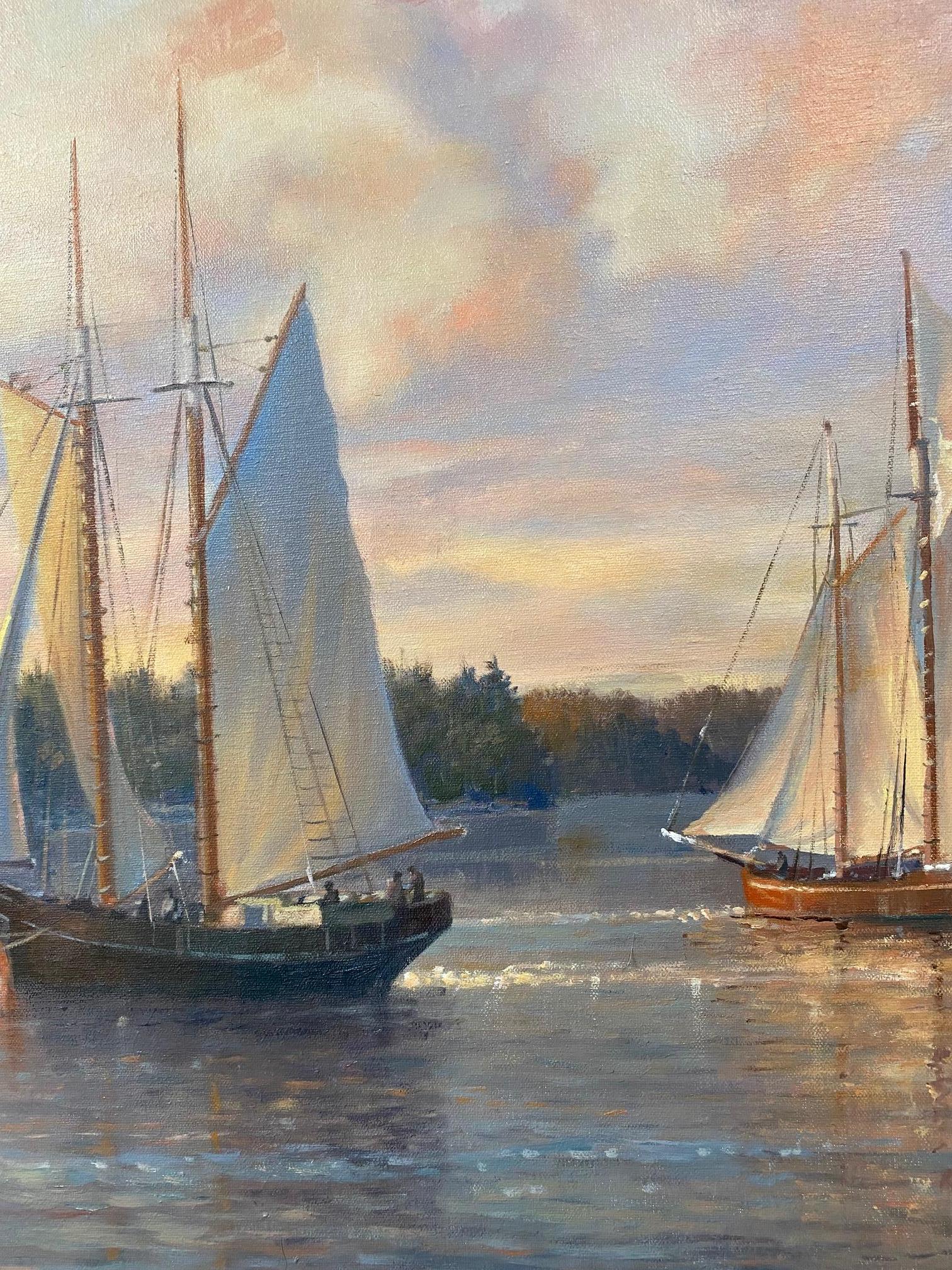 Oh the stories that this coastal scene at the last light of the day could tell! The sky is nearly flashing as the sun light diminishes sending pools of sparkles on the water's surface. The crew and guests on the schooners, smaller sailboats and