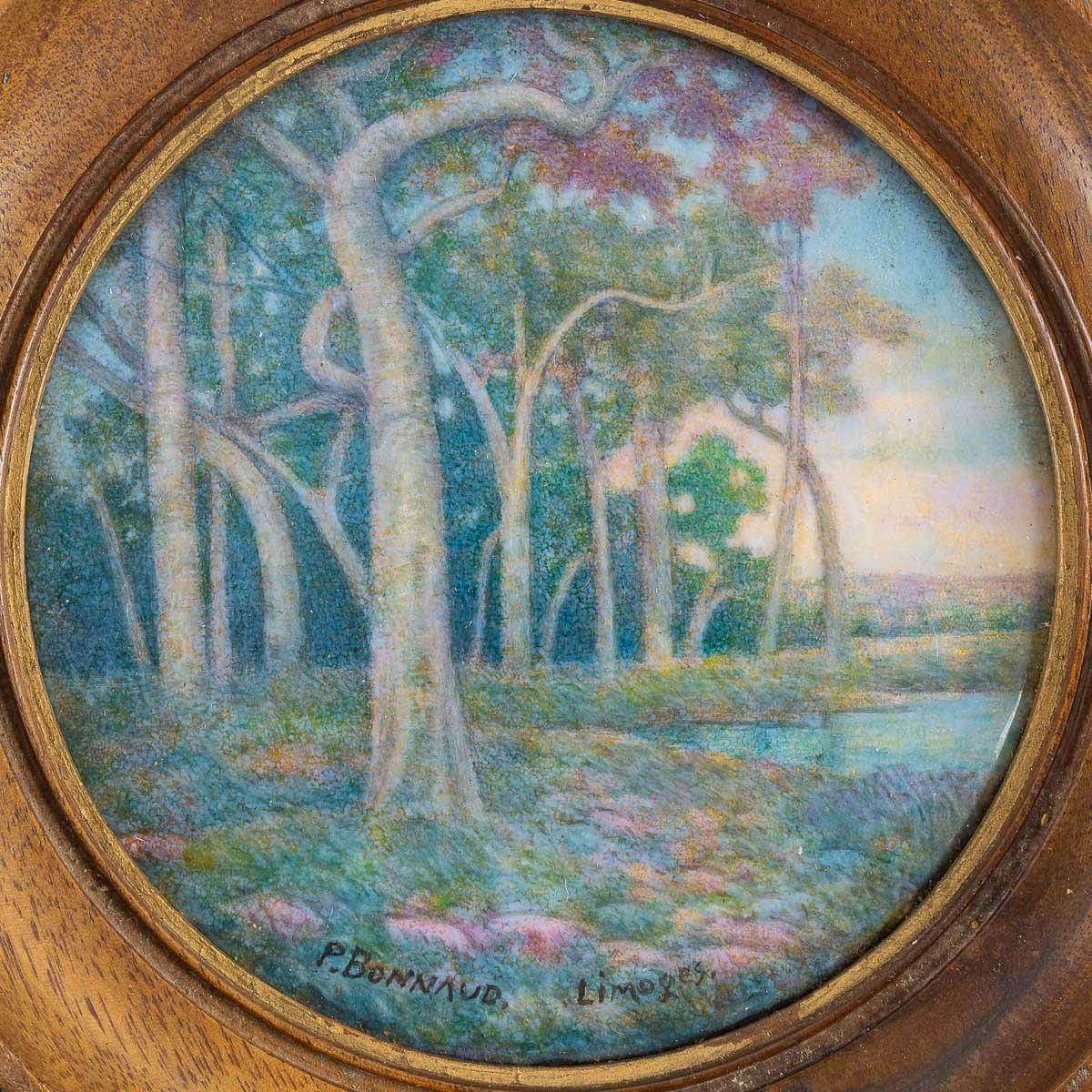 Paul Bonnaud (1876–1953), Limoges 
“Trees by a Lake”
Symbolist Art Nouveau Landscape 
A circular polychromic enamel plaque.
In a carved varnished wood frame
Signed and located Limoges
Circa 1900

Paul Bonnaud was a master enameler in Limoges at the