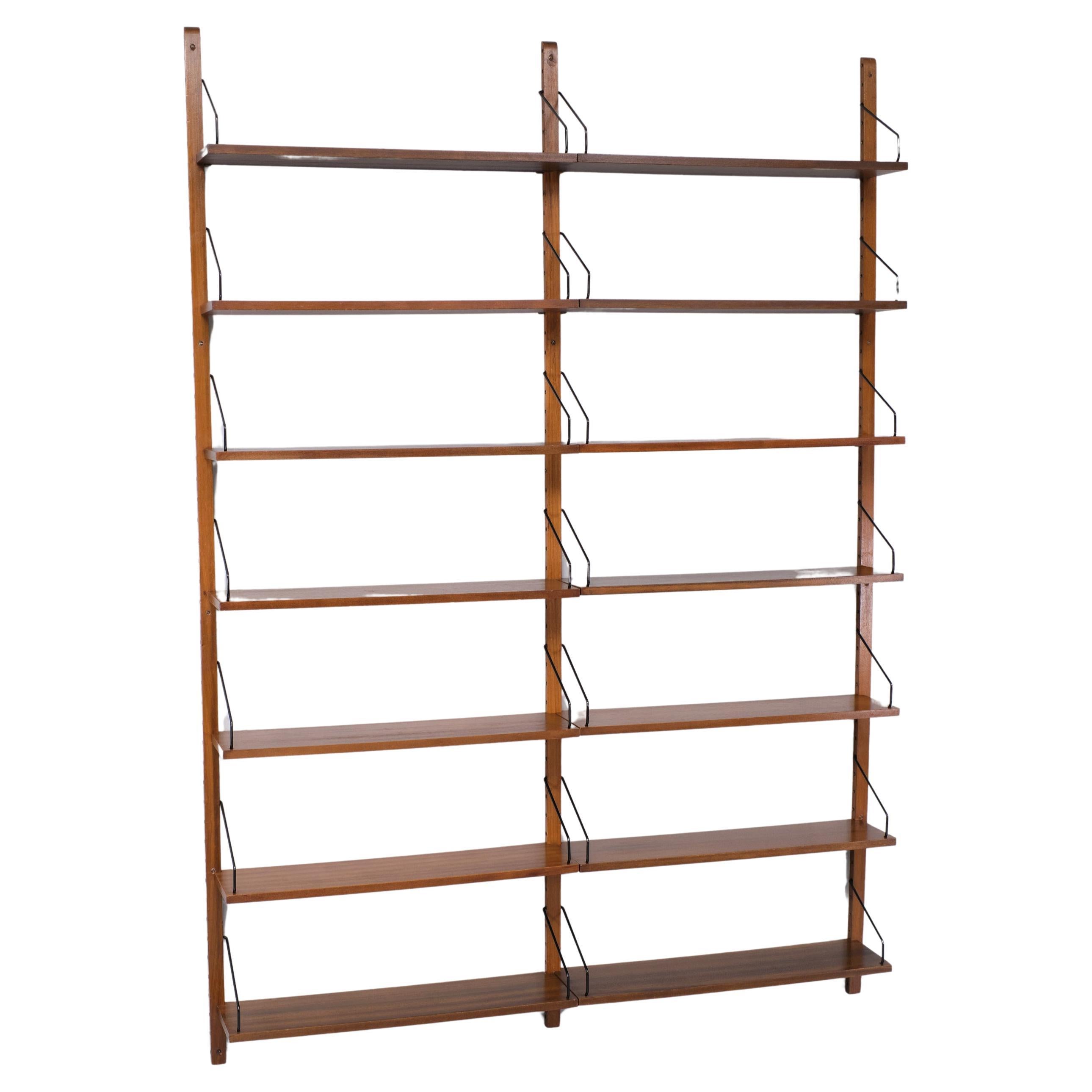 Very nice High Wall Unit by  Poul Cadovius  ideal bookcase . Three high 
uprights . comes with 14 shelves ,and all its original hardware . even there 
original Brass screws .  signed .  Good condition. 

Please don't hesitate to reach out for