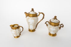 Paul Canaux & Cie. Partial Gilt Porcelain Coffee Service With Gilt Silver Mounts