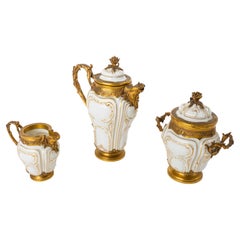 Paul Canaux & Cie. Partial Gilt Porcelain Coffee Service With Gilt Silver Mounts