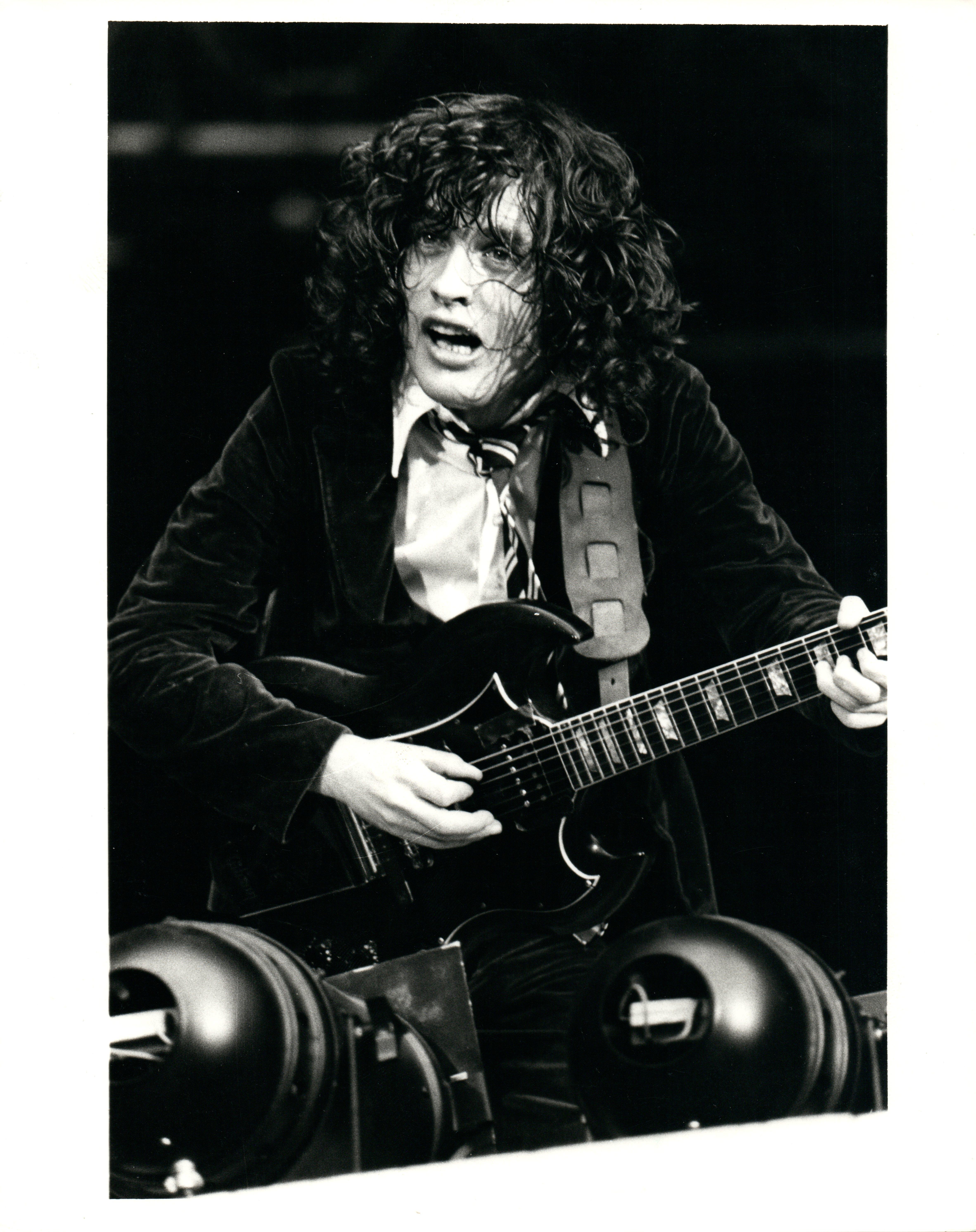 Paul Canty Portrait Photograph - Angus Young Rocking Out Vintage Original Photograph