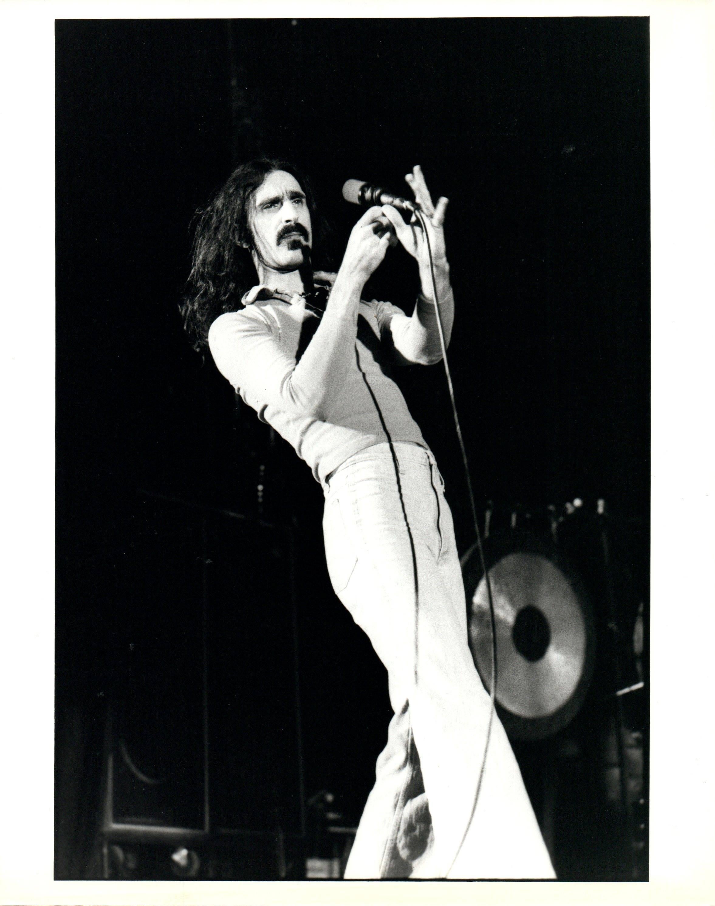 Paul Canty Portrait Photograph - Frank Zappa on Stage Holding Mic Vintage Original Photograph