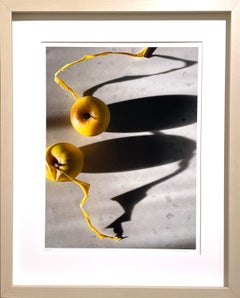 Framed #2275: still life photograph w/ yellow apples & abstract shadow patterns