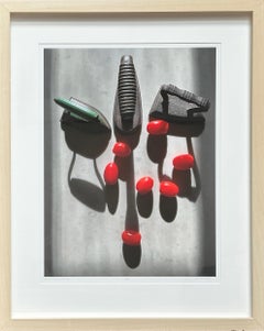 Framed Tomatoes and Irons: still-life photograph w/ abstract shadow patterns