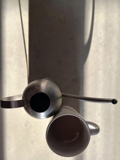Untitled 0472: still life photograph w/ gray vessels & abstract shadow patterns