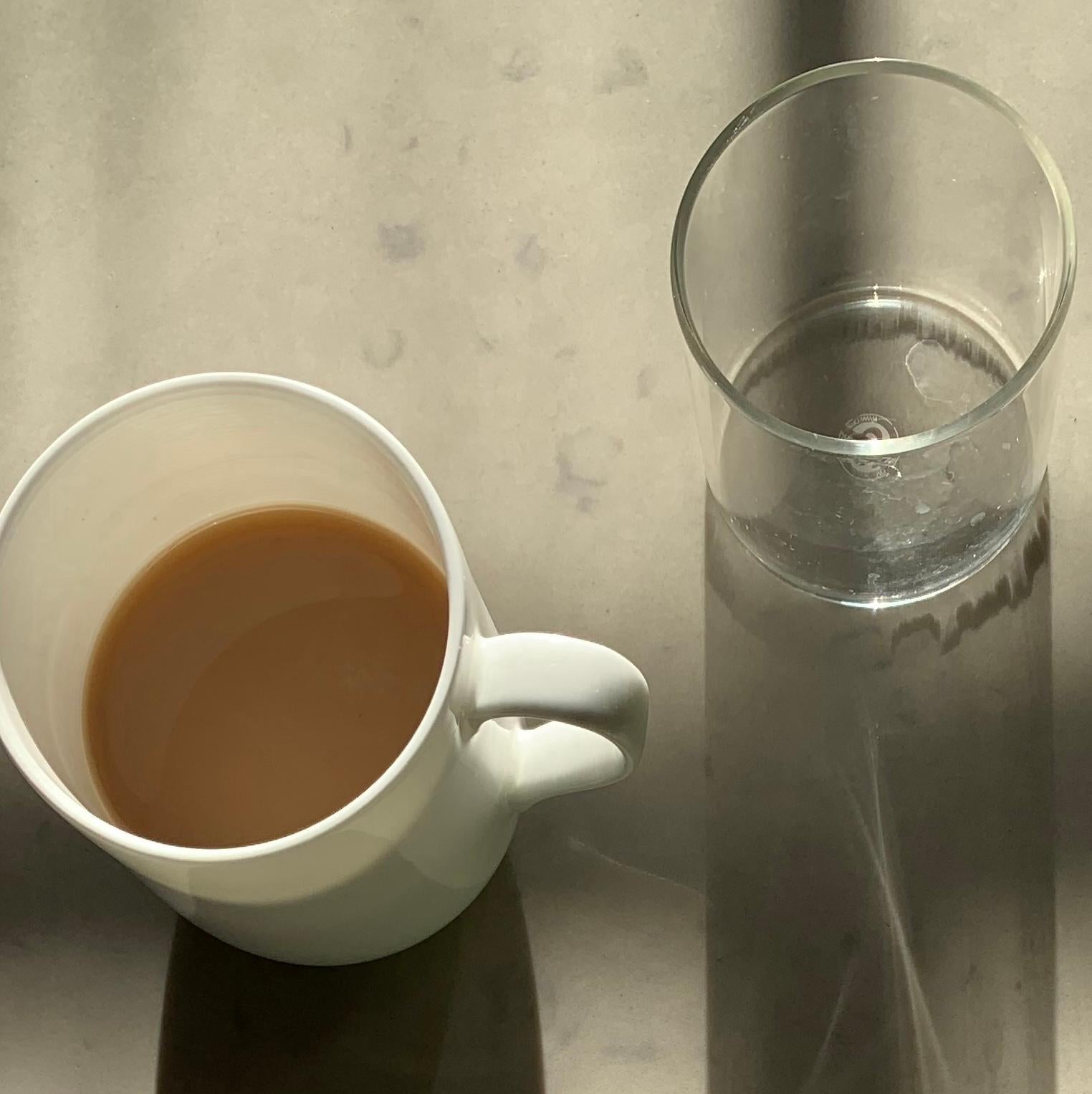 Untitled 1994: still life photograph w/ coffee cups & abstract shadow patterns - Photograph by Paul Cava
