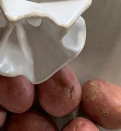 Untitled 2322: still life photograph w/ white cast foot, antler, bone & potatoes