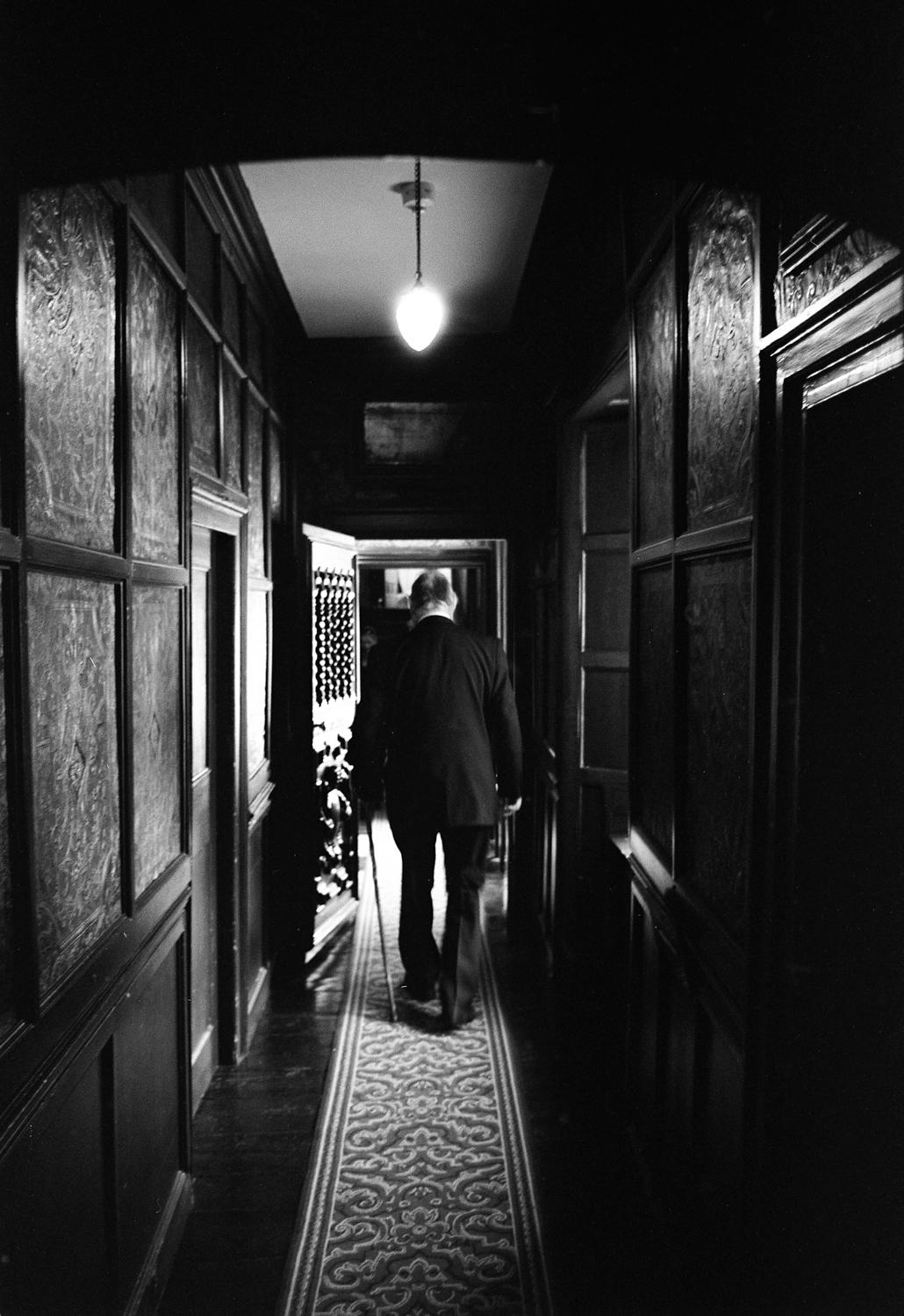 Paul Cooklin Landscape Photograph - Edition 2/10 - Old Man in Corridor, Oxburgh Hall, Silver Gelatin Photograph