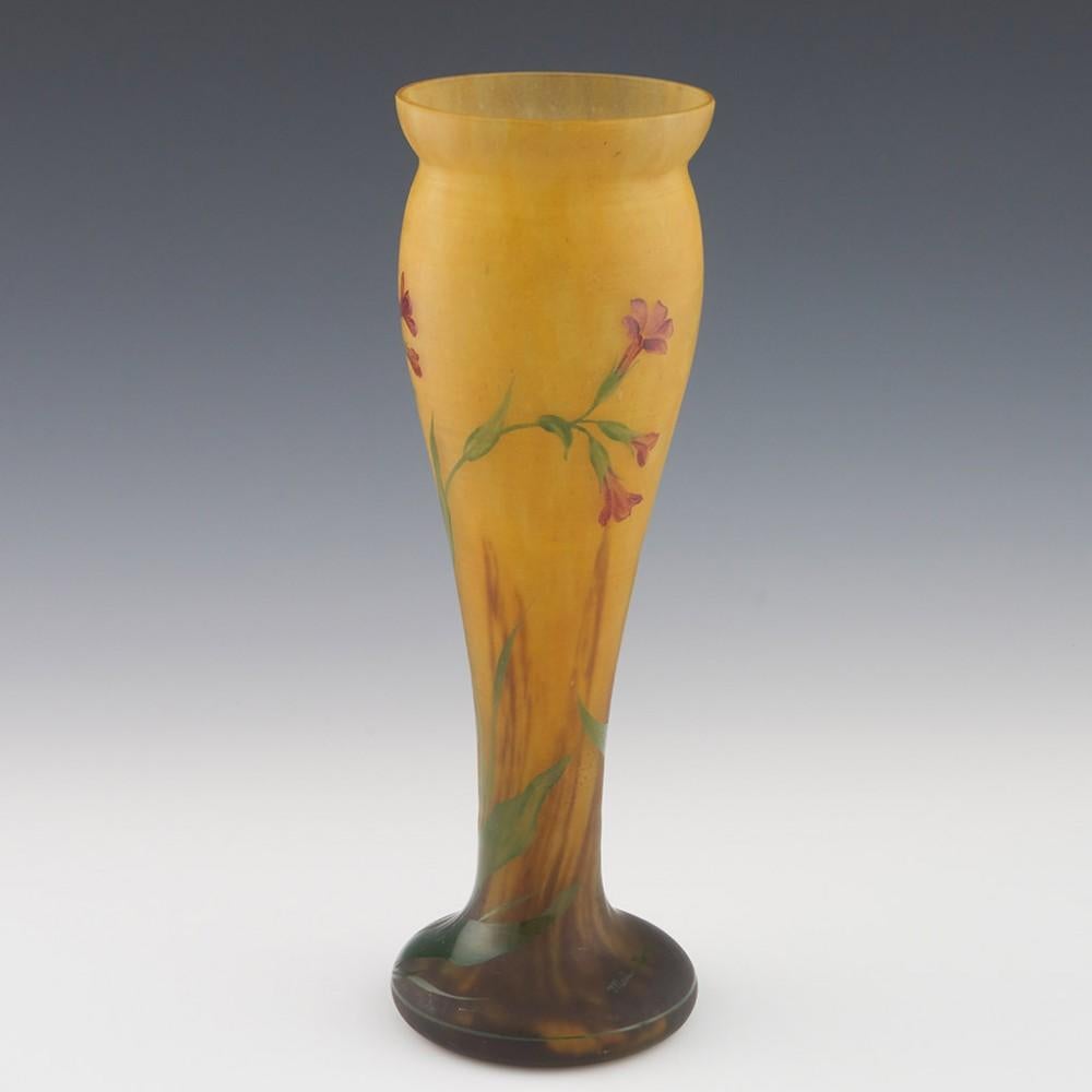 Heading : Mado Nancy Daum vase
Date : c1925
Period : 20th Century
Origin : The Belle Etoile, Croismare, France
Colour : Mottled orange and lemon ground enamelled in puce orange and green. The foot cased in satin finish clear glass
Bowl : Decorated