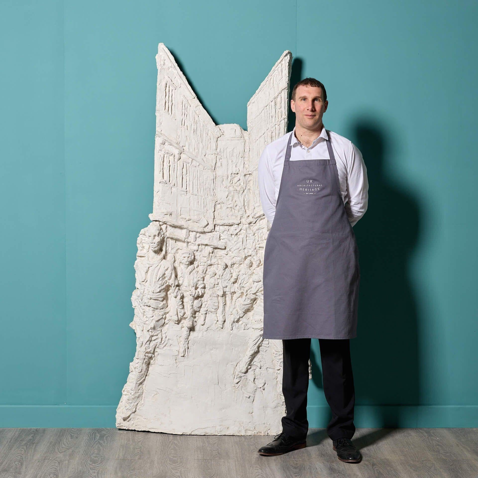 A large and intricately detailed plaster sculpture of a street scene by celebrated British sculptor, Paul Day. Thought to be an original maquette – a model for a larger piece of sculpture or a later bronze – this 3D wall sculpture reflects Day’s