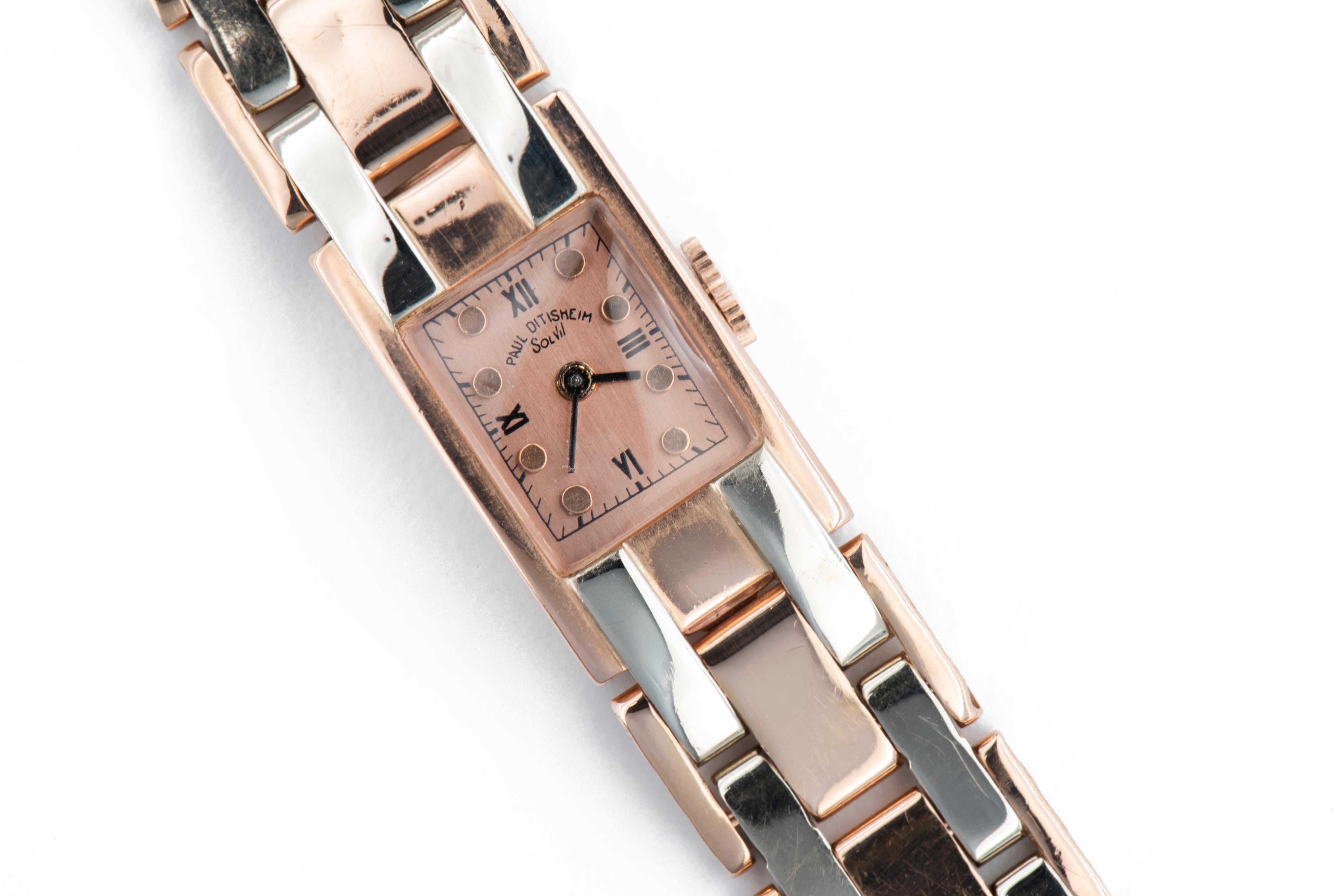 Paul Ditisheim Solvil 14K Rose Gold Tank Watch Vintage 1940's
Rare 1940’s two-tone 14K rose and white gold Paul Ditisheim tank style watch. The 16mm x 25mm rectangular rose gold case has a domed crystal, rose gold dial with Roman quarter hours,