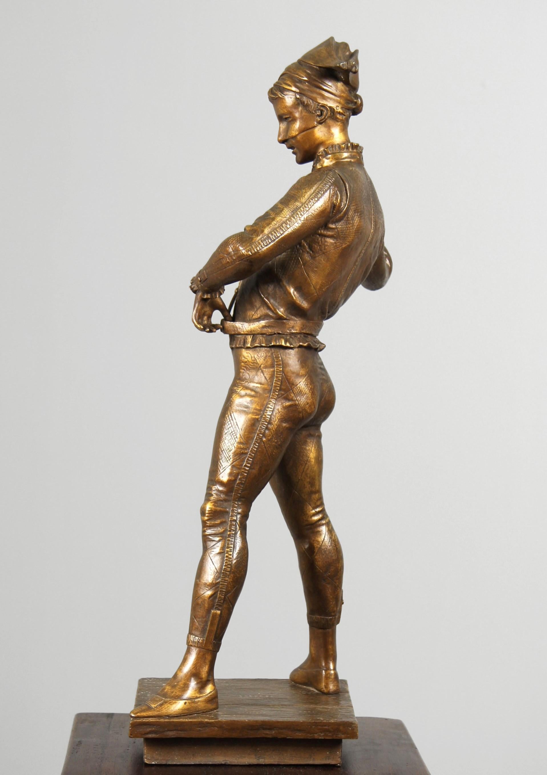Paul Dubois - The Harlequin

France
bronze
around 1880

Dimensions: H x W x D: 59 x 19 x 18 cm

Description:
Figure standing on an almost square base. The base, with the appearance of wooden planks arranged in a row, represents the Harlequin's