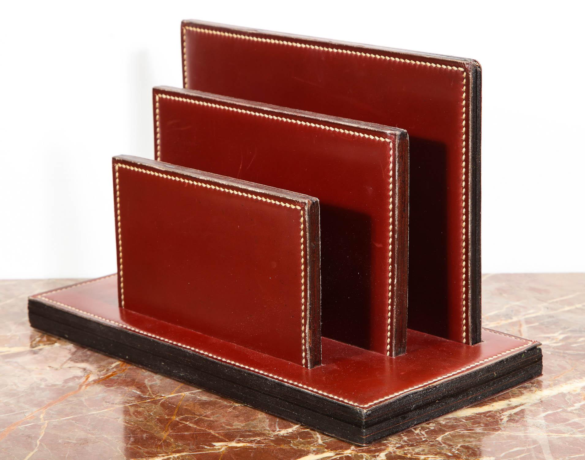 Paul Dupre-Lafon for Hermes Paris, four-piece leather desk set, 
circa 1940

comprising: 

(1) Hinged desk pad - (open 27