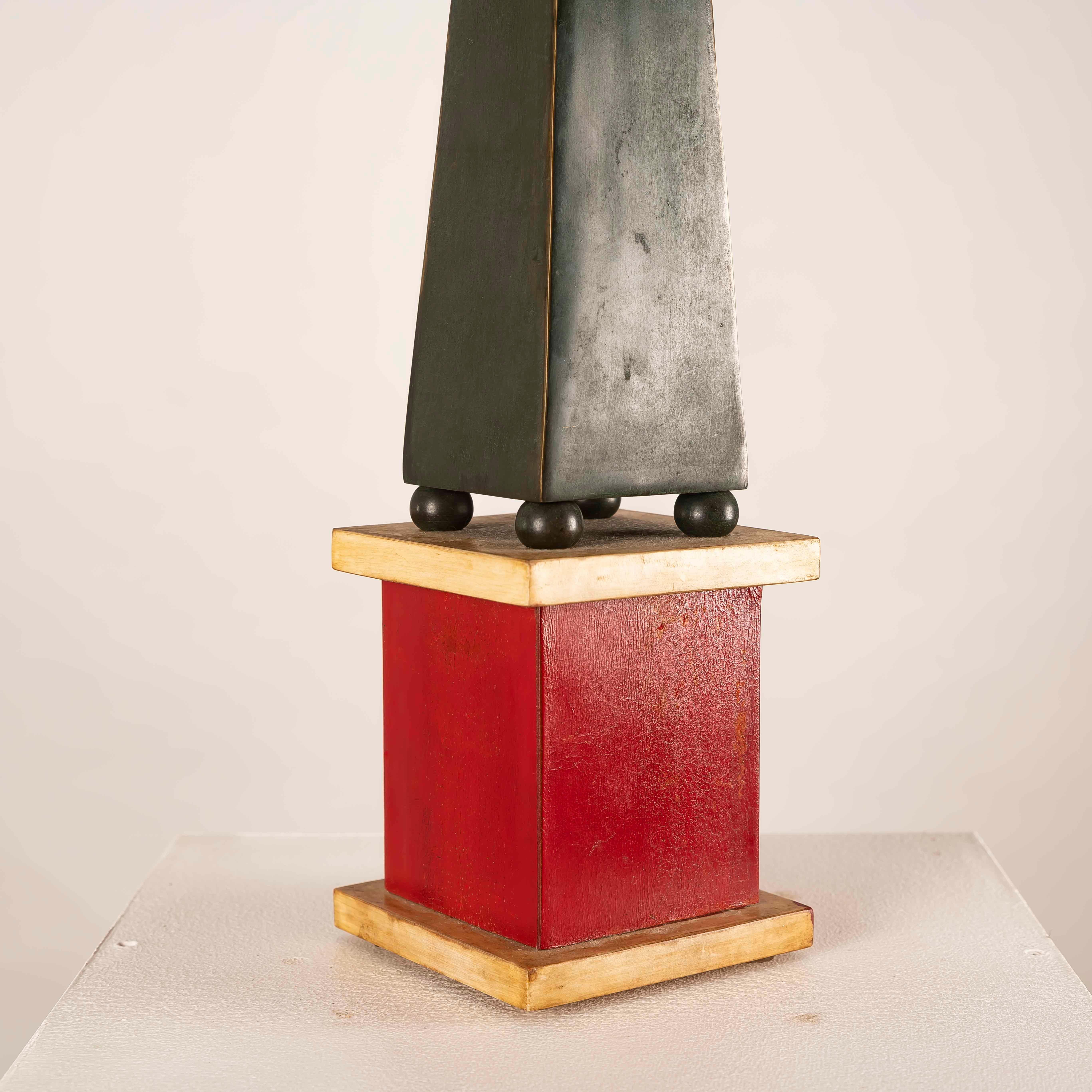 This refined obelisk sculpture, attributed to Paul Dupré-Lafon, illustrates the architectonic rigor and luxurious materiality of French Art Déco design. Dating from circa 1940, the obelisk is crafted in patinated bronze, its surfaces displaying