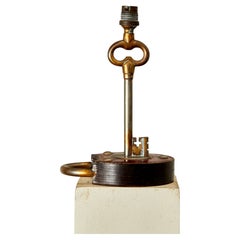 Paul Dupré-Lafon, Table lamp, leather and gilt brass, circa 1970, France.