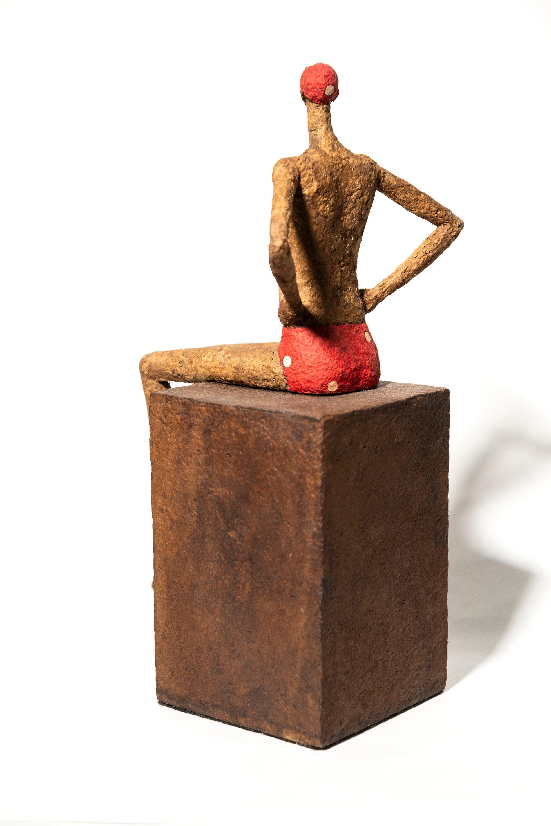 Quebec Artist Paul Duval’s series of small figurative tabletop sculptures capture the essence of individual characters. Hand-shaped from wire and paper mache, each character is unique—this piece is a swimmer (baigneur) sporting a red bathing suit