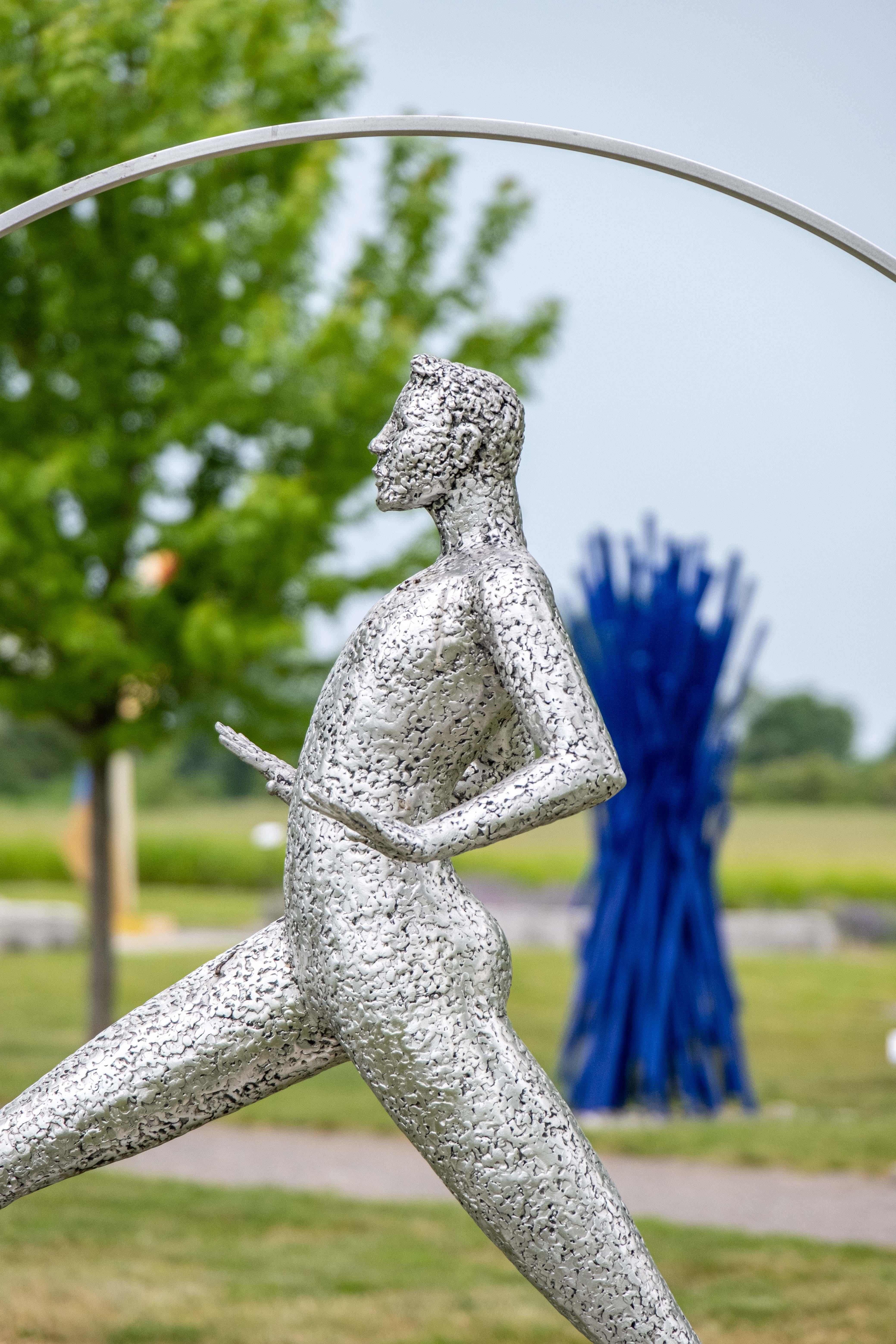Engaging and playful, Quebec sculptor Paul Duval’s artwork often contemplates the idea of balance and imbalance. ‘Desequilibre’ in French actually means ‘unbalance.’
Here a figure stands, legs set apart and arms out as if trying to maintain balance