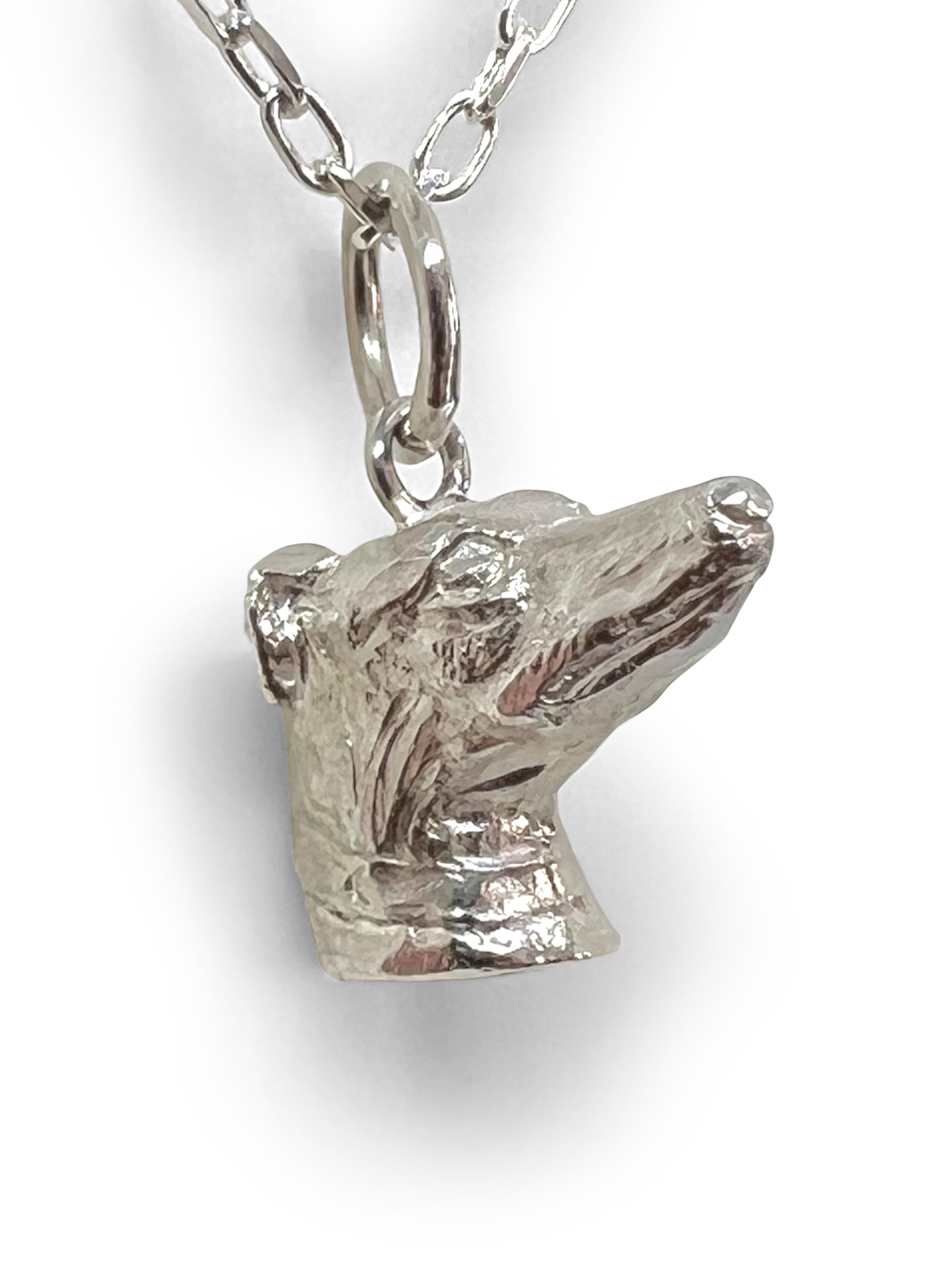    From Great Britain Paul Eaton VPRMS MAA sculpted a Greyhound dog head pendant (3/4
