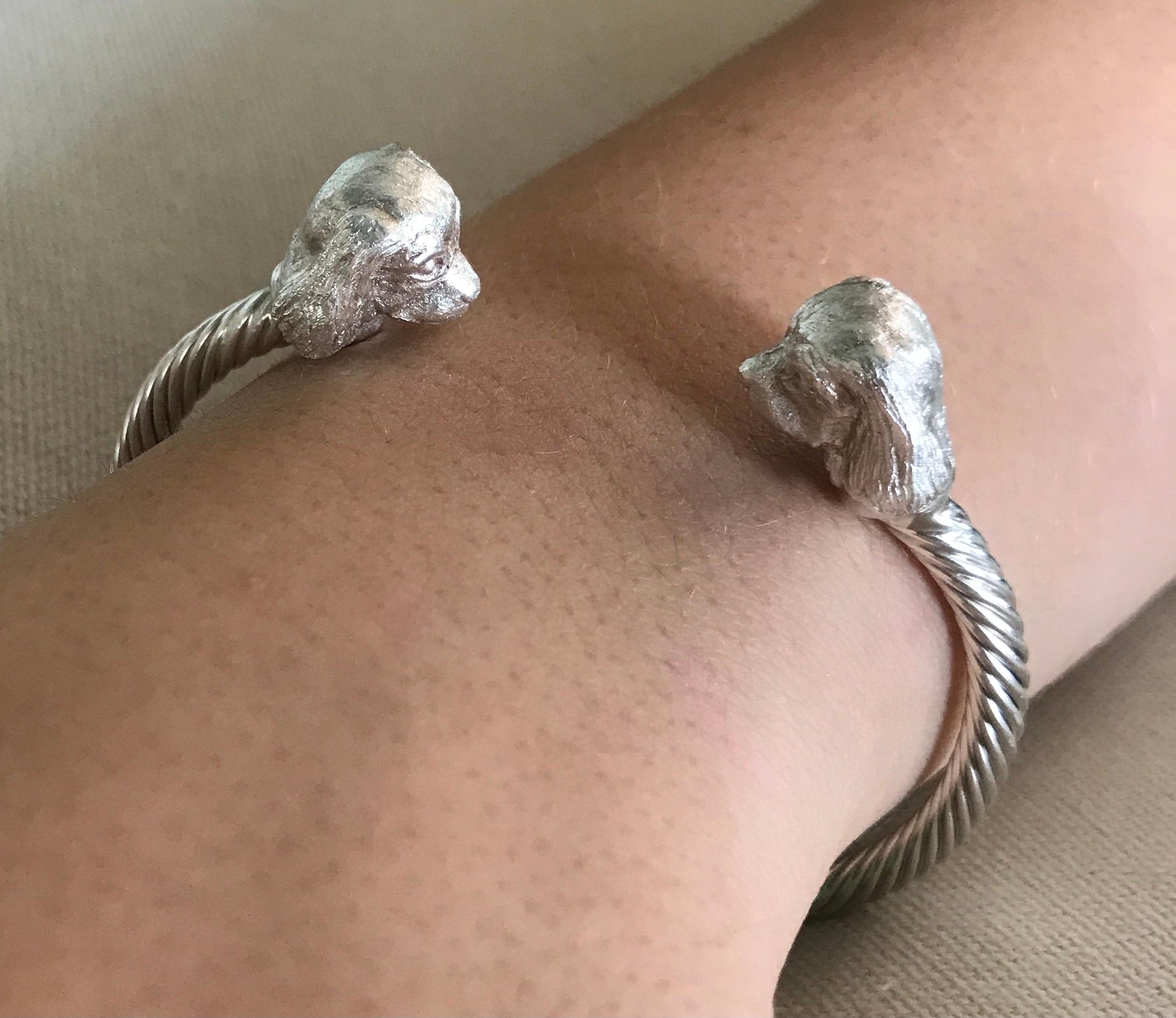 Intricately hand carved dog miniatures of Cavalier King Charles Spaniel Heads (details in photos) on a sterling silver twisted bangle are made by England’s Paul Eaton who is possibly the world's best miniature sculptor of dogs and animals and a