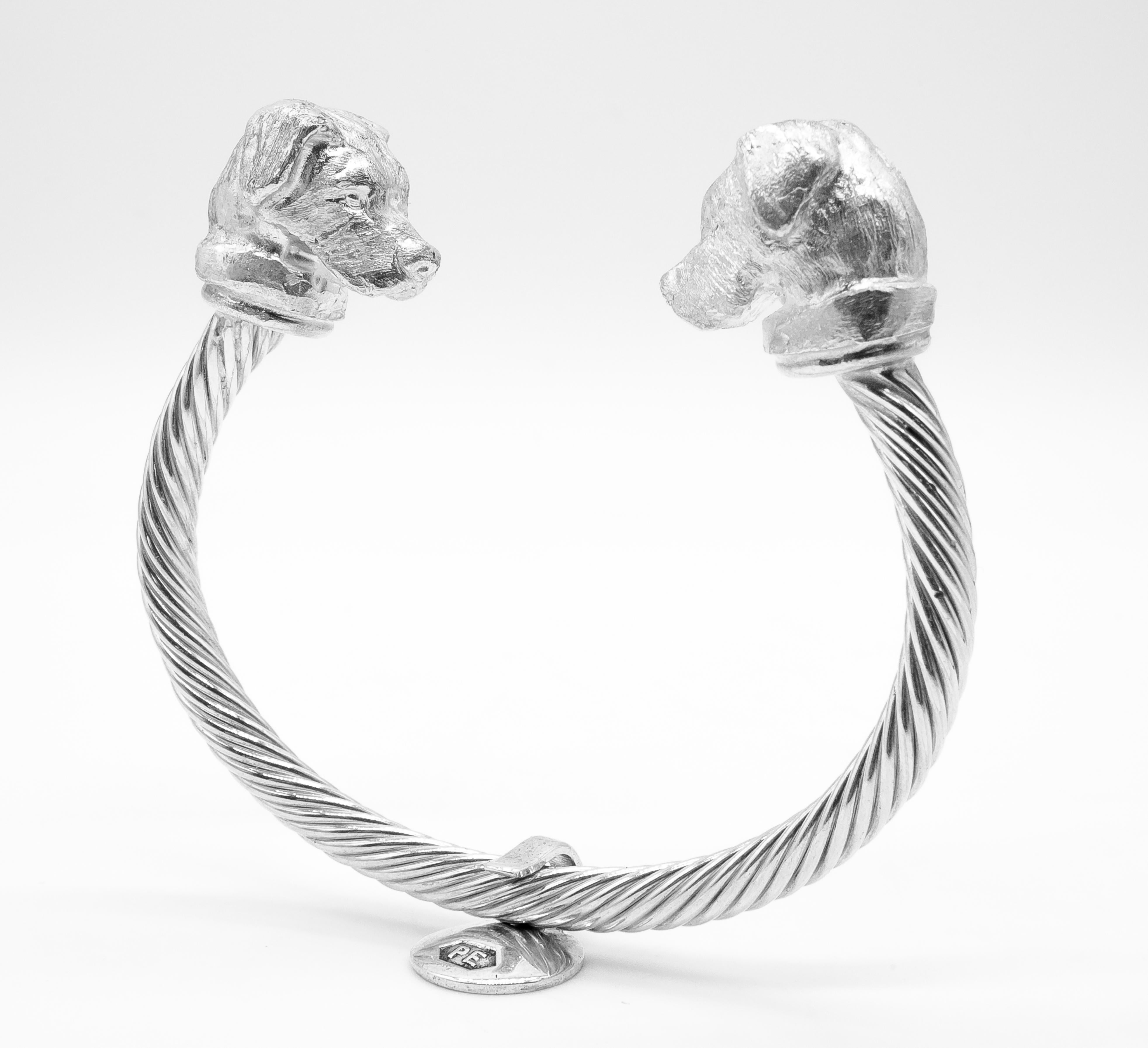 British wildlife sculptor PAUL EATON's bespoke hand-carved dog miniature sculptures of Mastiff or Family Crest Dog Heads on a sterling silver twisted bangle are beautiful works of art. Paul Eaton’s bespoke dog bangles are made by hand and this