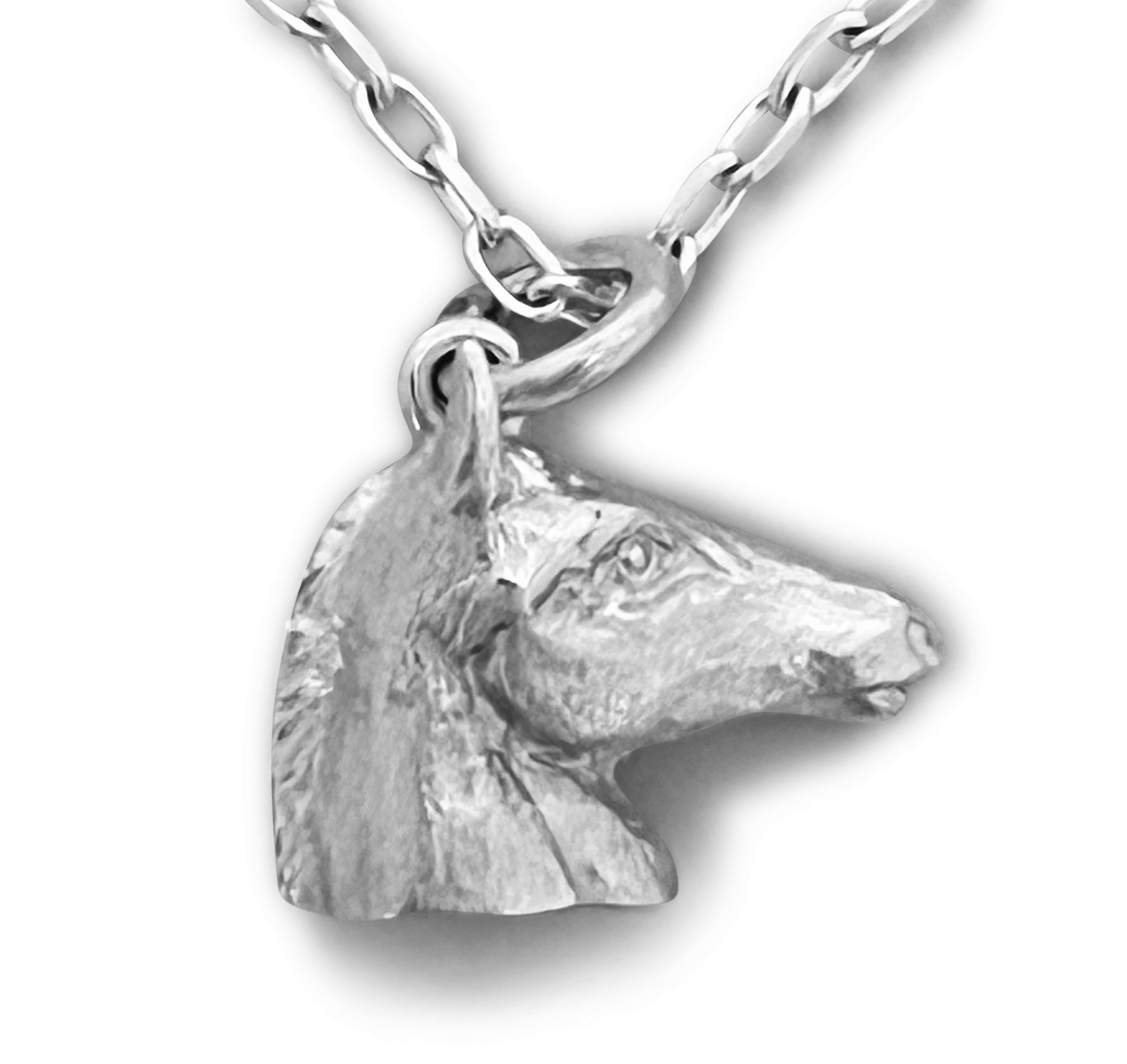 Discover the exquisite art of England’s renowned miniature wildlife sculptor, PAUL EATON, with his sculpted sterling silver horse charm or pendant.    Each bespoke animal pendant is meticulously carved, individually cast, and carefully hand-finished