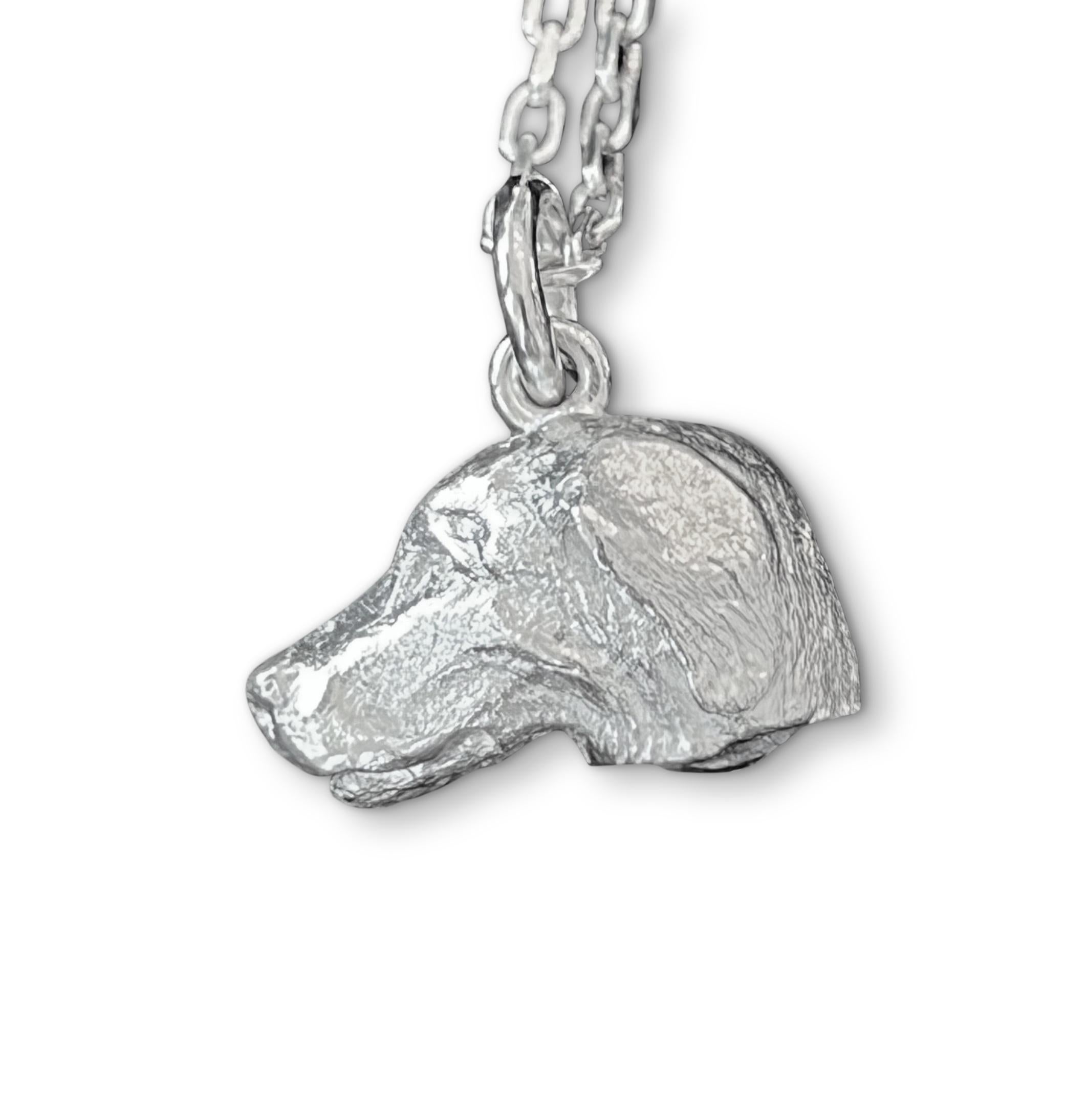 Discover the exquisite art of England’s renowned miniature wildlife sculptor, PAUL EATON, with his sculpted sterling silver Labrador dog charm or pendant.    Each bespoke animal pendant is meticulously carved, individually cast, and carefully