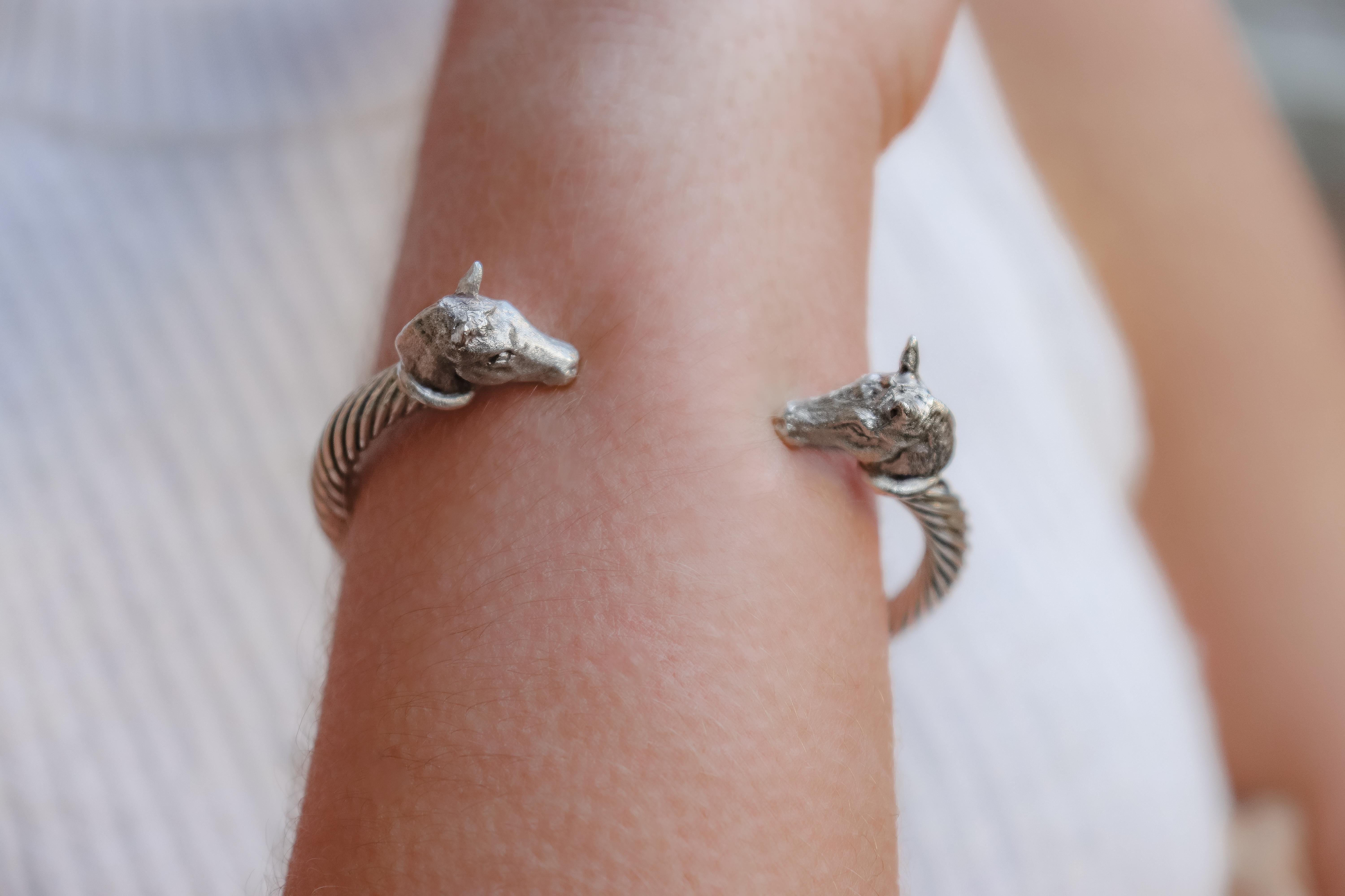 Intricately hand carved miniatures of Pony Heads (details in photos) on a sterling silver twisted bangle are made by England’s Paul Eaton who is possibly the world's best miniature sculptor of dogs and animals and a master gold/silversmith.  Each