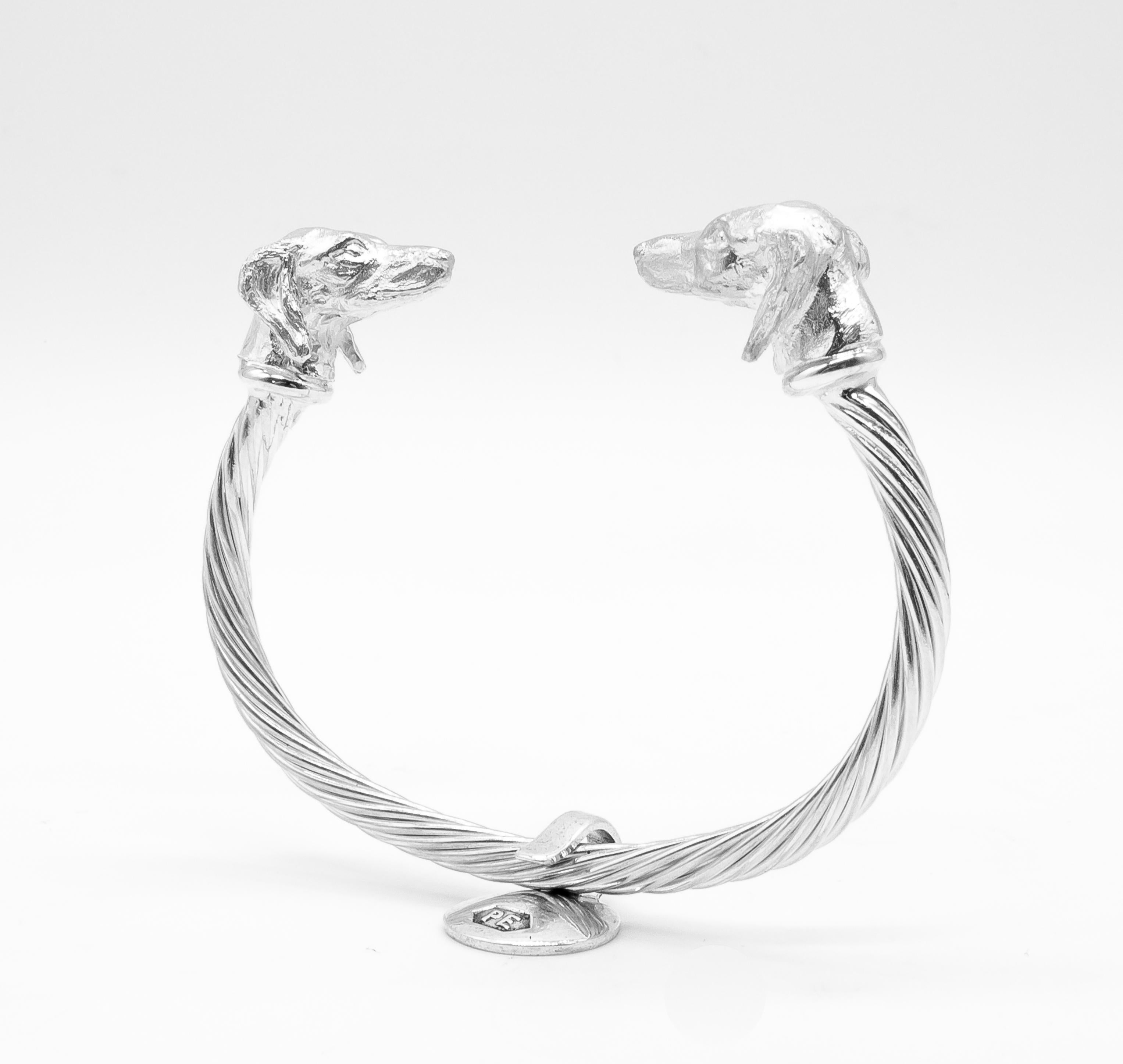 Intricately hand carved dog miniatures of Saluki Heads (details in photos) on a sterling silver twisted bangle are made by England’s Paul Eaton who is possibly the world's best miniature sculptor of dogs and animals and a master gold/silversmith. 