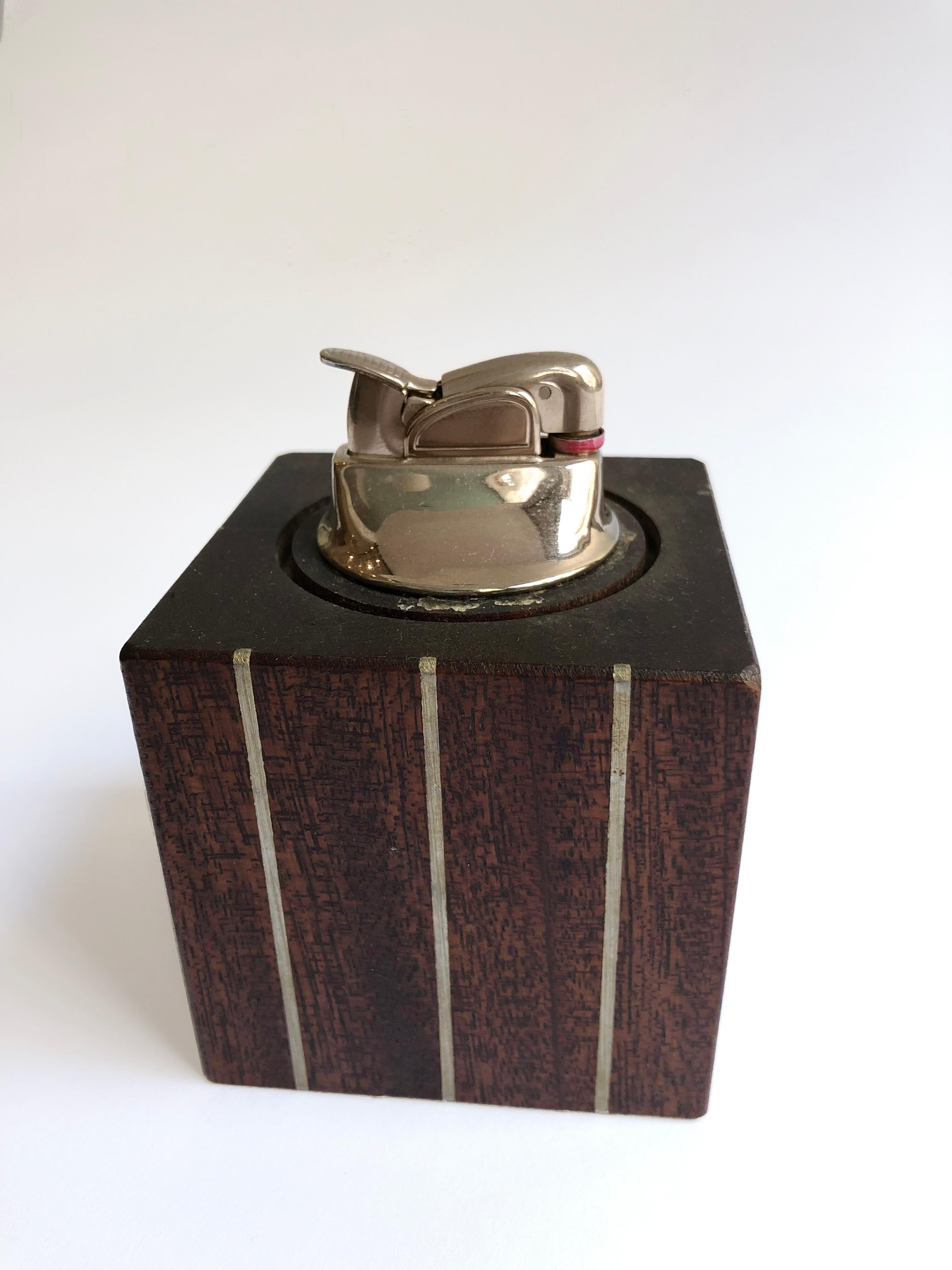 Paul Evans smoking set constructed from cuban mahogany and inlayed pewter, with removable pewter cap. Inset petwer plug in base reads 'Designers Inc Paul Evans'.