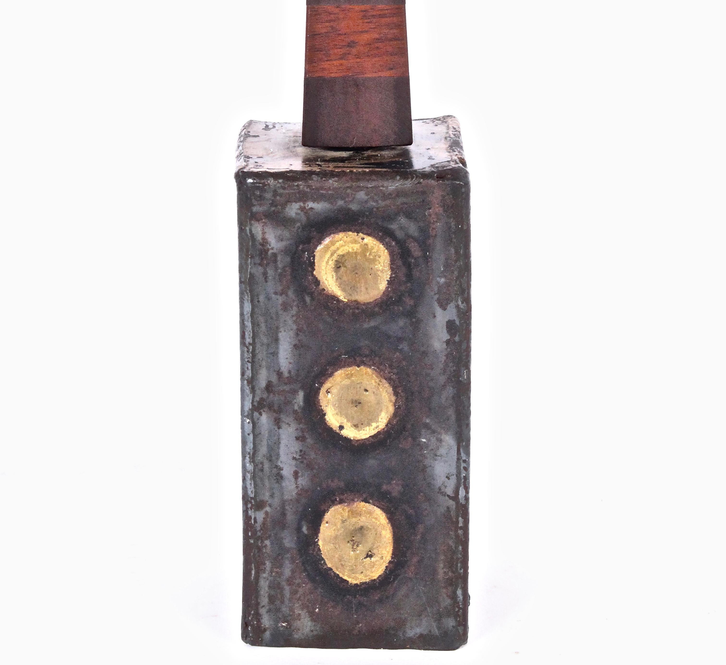 Early collaborative Paul Evans and Phillip Lloyd Powell torch cut metal Hand held Bell, early 1960s. Featuring a hand worked rectangular Iron bell form, circular Brass details with stacked Walnut and Cherry obelisk handle.
   