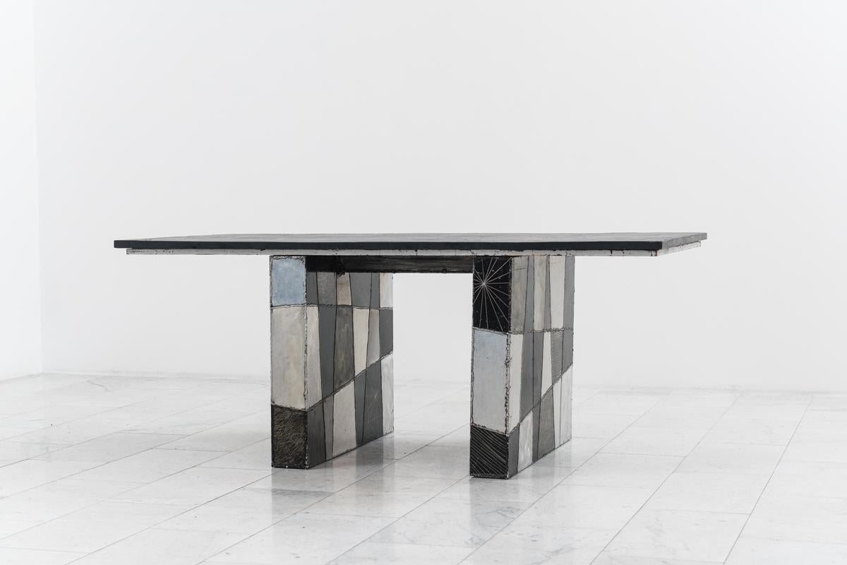 Signed “Paul Evans 67” this adaptable desk is composed of a Pennsylvania slate top resting on two checker patterned pedestals. Two rolling file cabinets can be positioned beneath the desktop for a compact workspace, or exposed for a more spacious