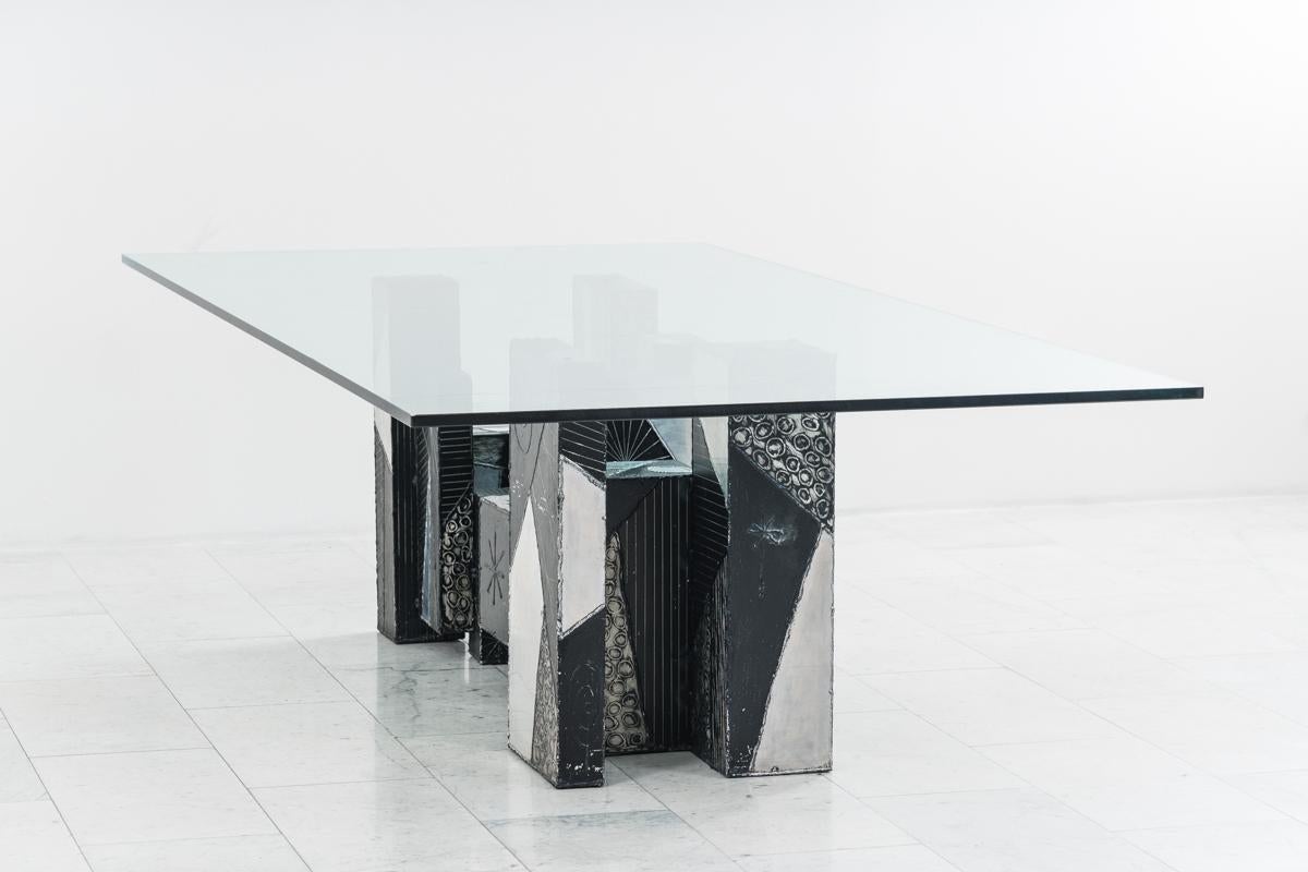 A popular form that Paul Evans would revisit through his career is a composition he called Skyline. Skyline pieces, such as this magnificent unique dining table, were comprised of individually hand-welded boxes of varying heights, shapes, textures