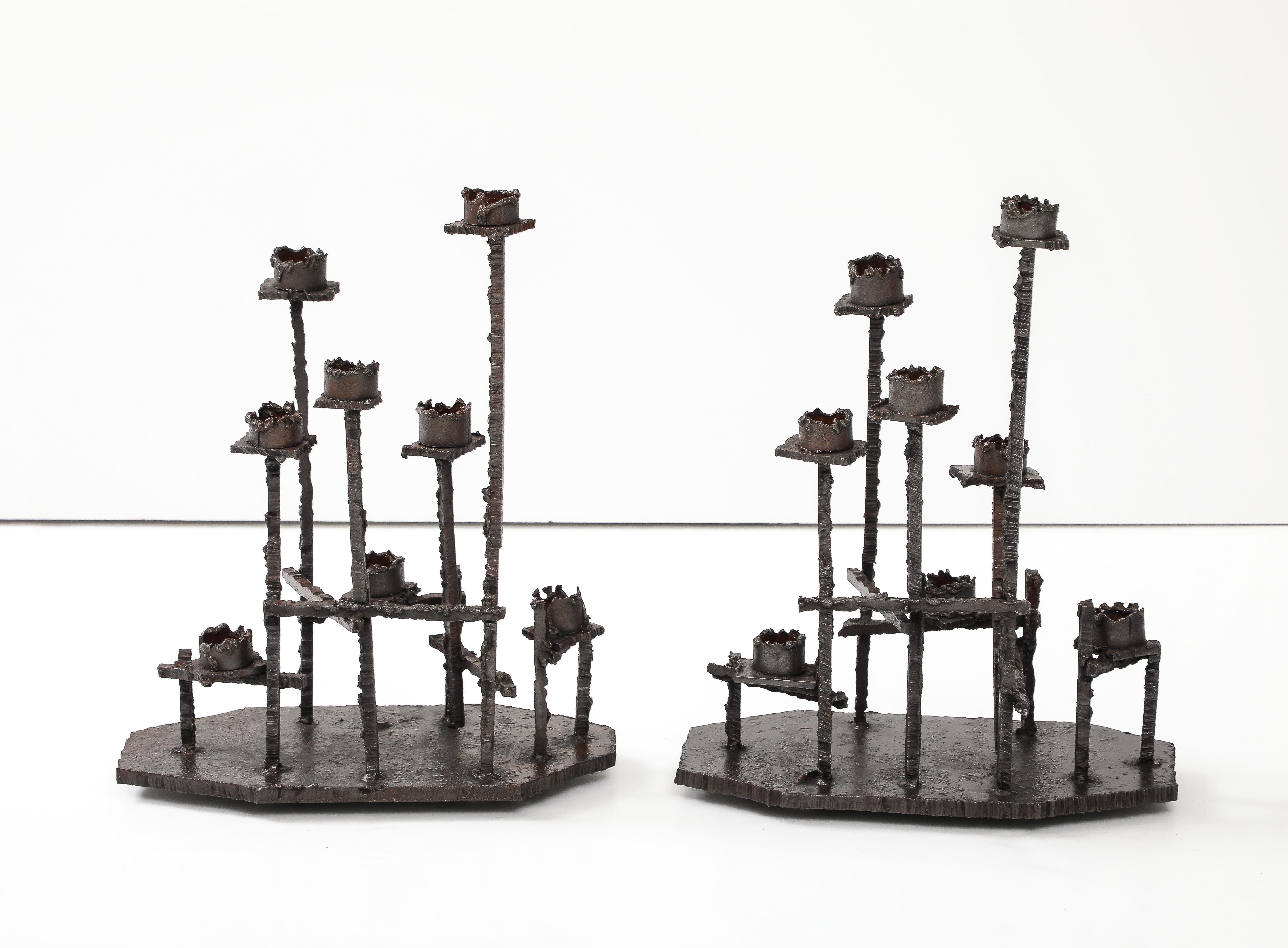 Stunning pair of large 1970s welded rusted steel brutalist candlesticks attributed to Paul Evans. With some wear and patina due to age and use.