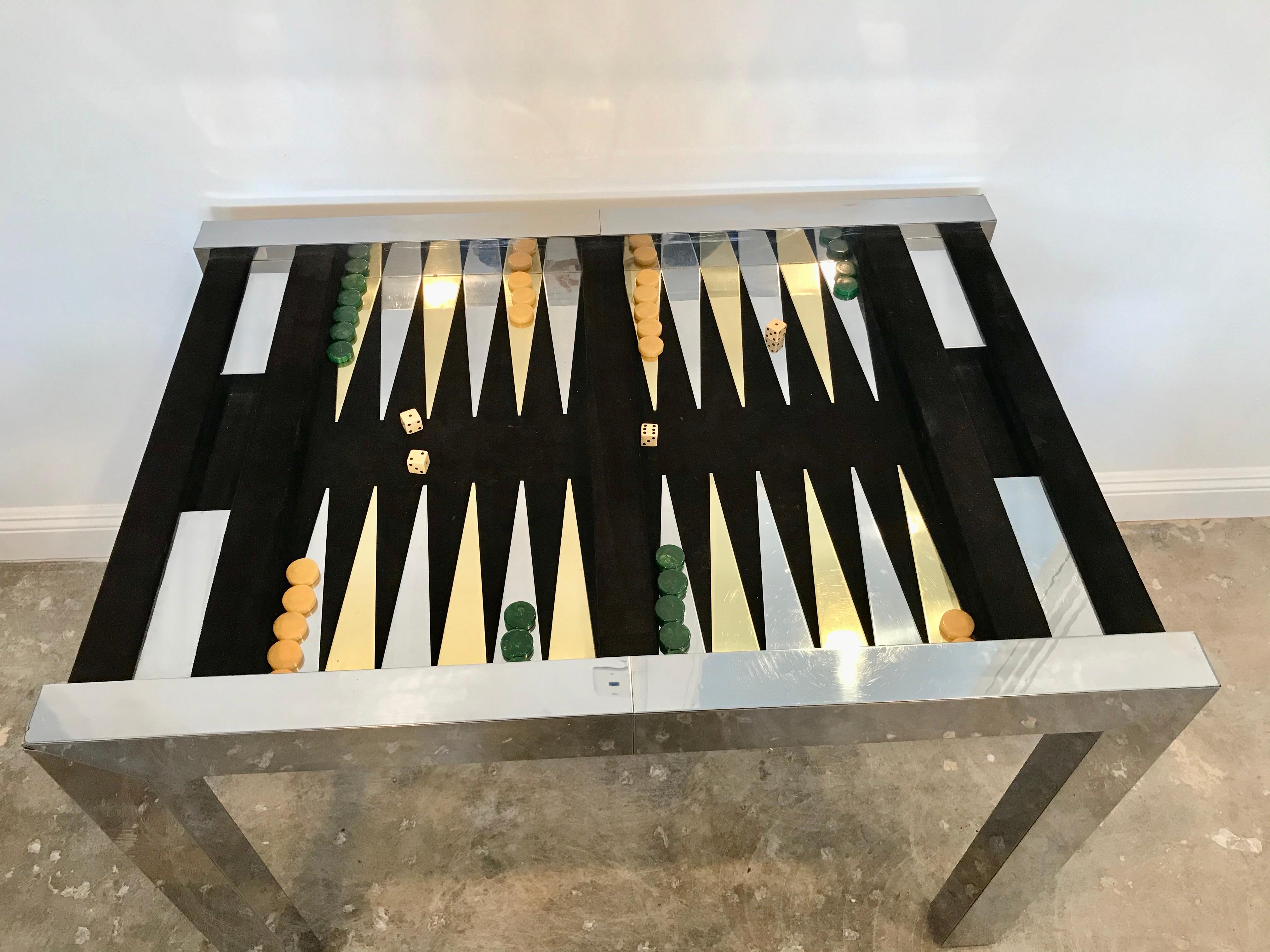 Stunning vintage backgammon table by Paul Evans for Directional. Steel frame with black suede table top. Aluminum and brass game board with suede backdrop. Fair vintage condition. Some scratches that have been buffed on outside of frame. Some