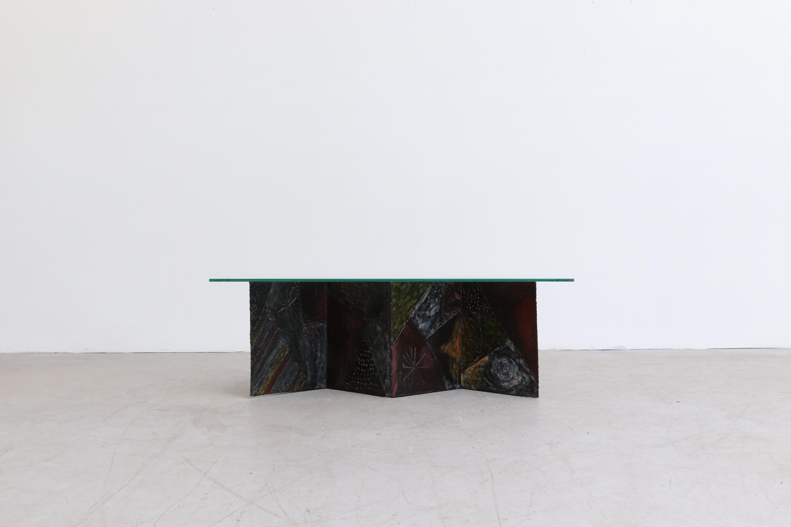 After Paul Evans Brutalist Zig Zag coffee table Model PE-11 with Welded and Painted Body and Glass Top. Glass measures 47.875 x 20 x 0.375. Base measures 38.75 x 13.25 x 15.875. In original condition with visible wear including scratches to glass.