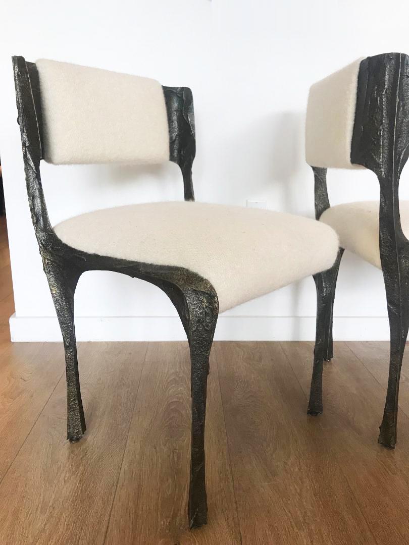 Set of two Brutalist sculpted bronze dining chairs Model PE106 by Paul Evans for Directional.
  