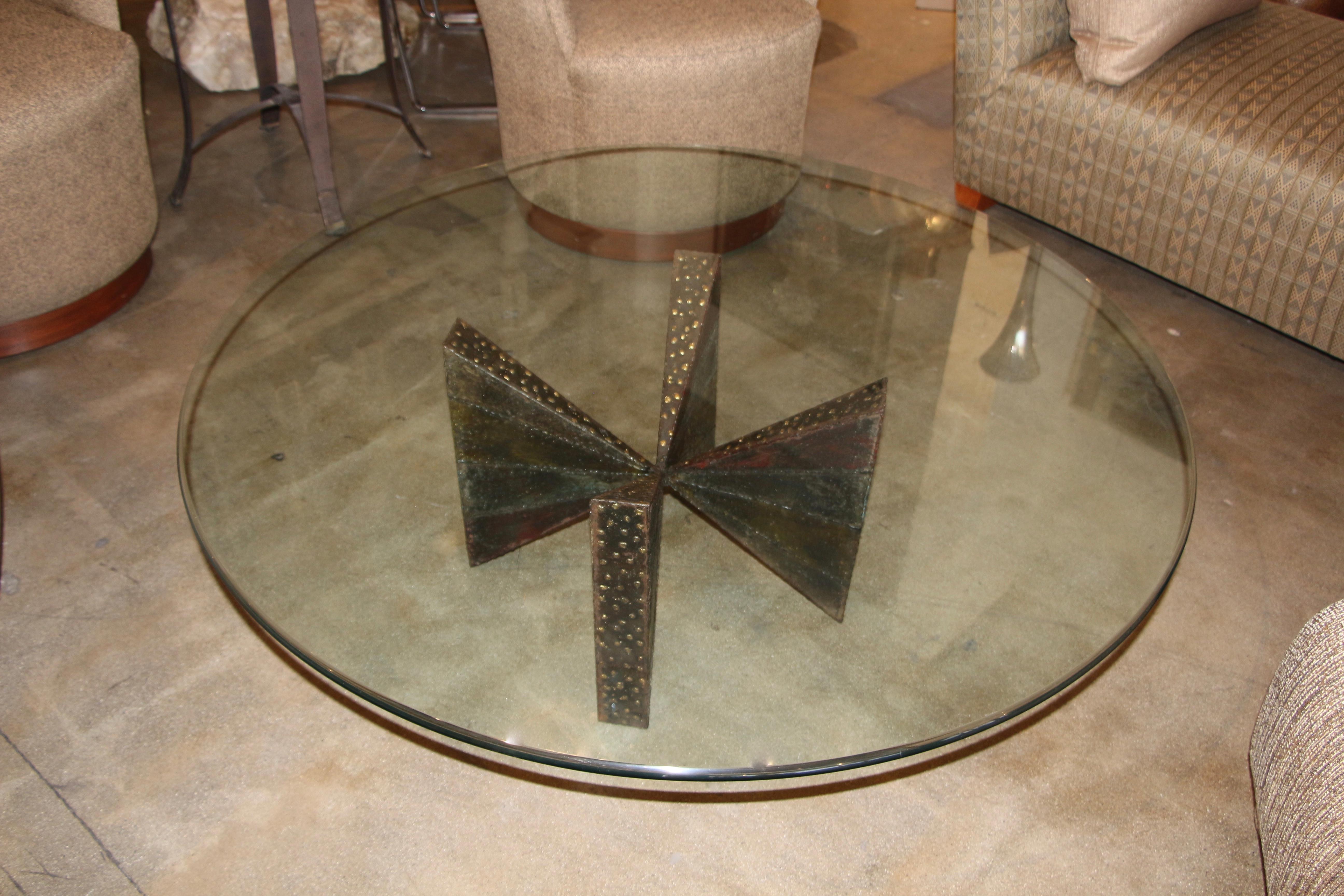A nice coffee table base by Paul Evans for Directional, monogrammed and dated 1967. has a 48 inch piece of glass on it. sells with or without the glass buyers choice. Nice color and patina with gold color brass/bronze accents. There is a some rust