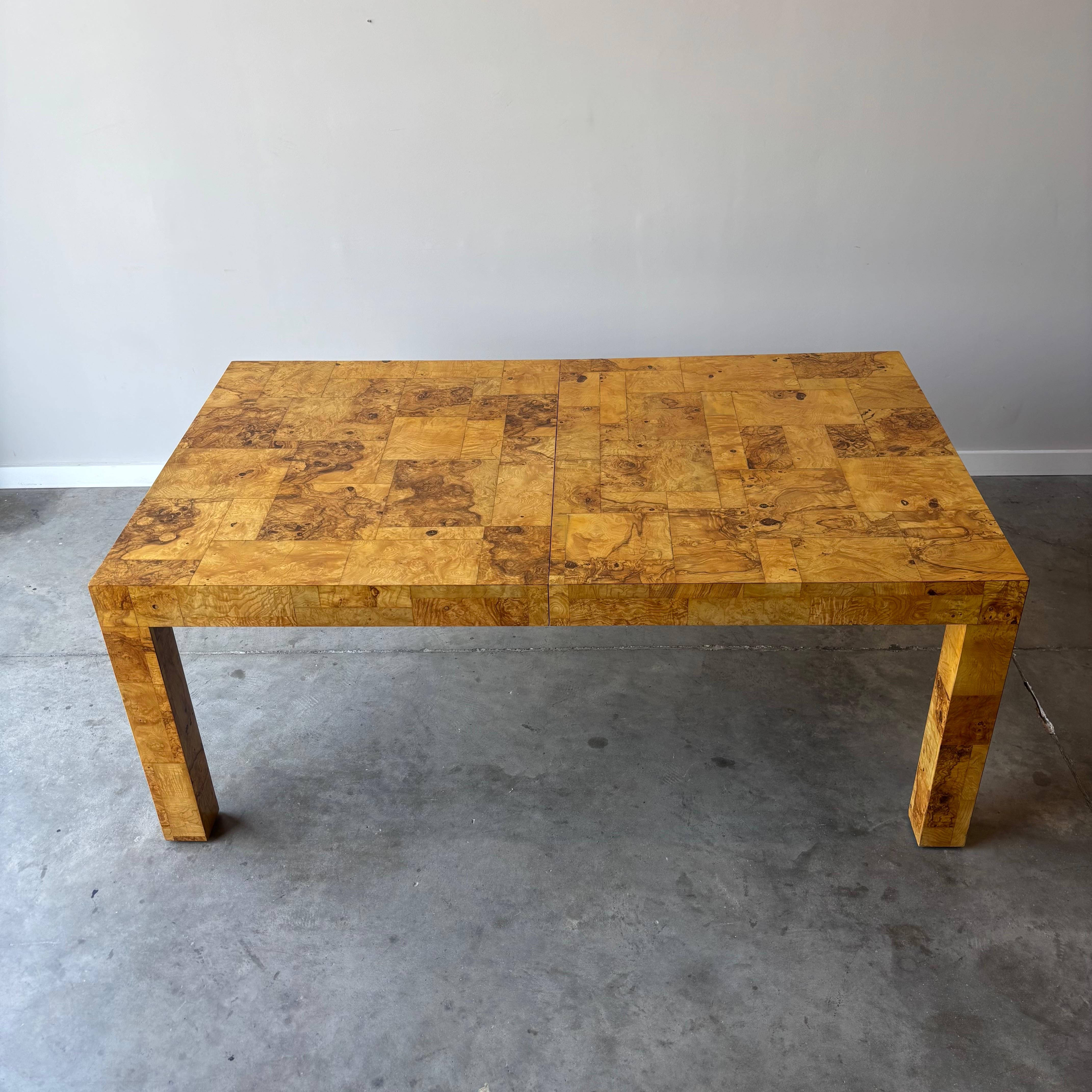 An incredible olive ash burl dining table by Paul Evans made by Directional, circa 1970.  This restored example measures 42