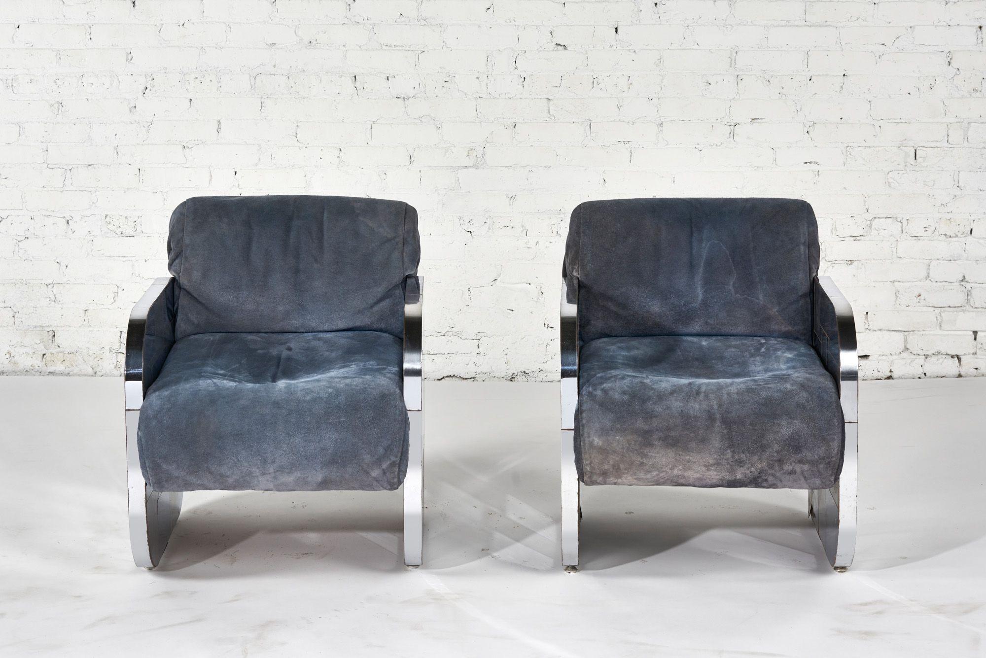 A rare pair of Paul Evans Cityscape Patchwork Lounge Chairs, 1970. Upholstery is blue suede all original. Patchwork is constructed of steel plate frames with contrast of polished chrome.
Vintage chairs show signs of use throughout, wear to original