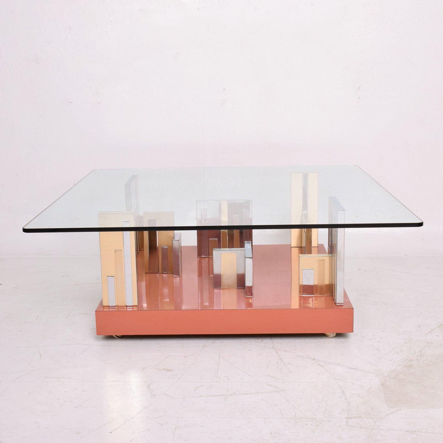 For your consideration a Mid-Century Modern city scape coffee table in original base (peach color)
Original glass top 42
