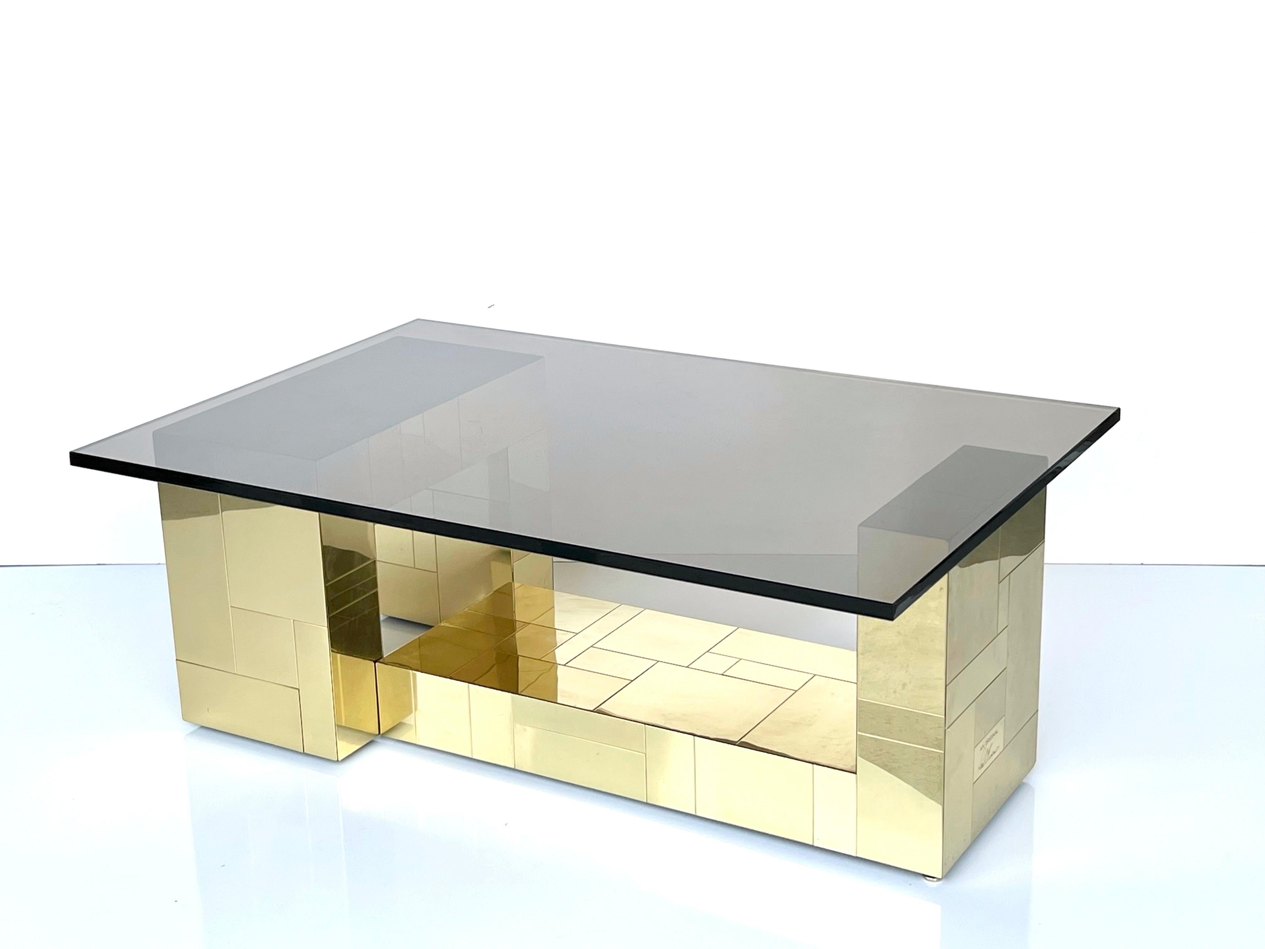 A Paul Evans cityscape coffee table done in brass. The base of the table consists of 2 independent elements. Offered with a top in bronze color glass. The bases can also accommodate a larger top and different configurations.