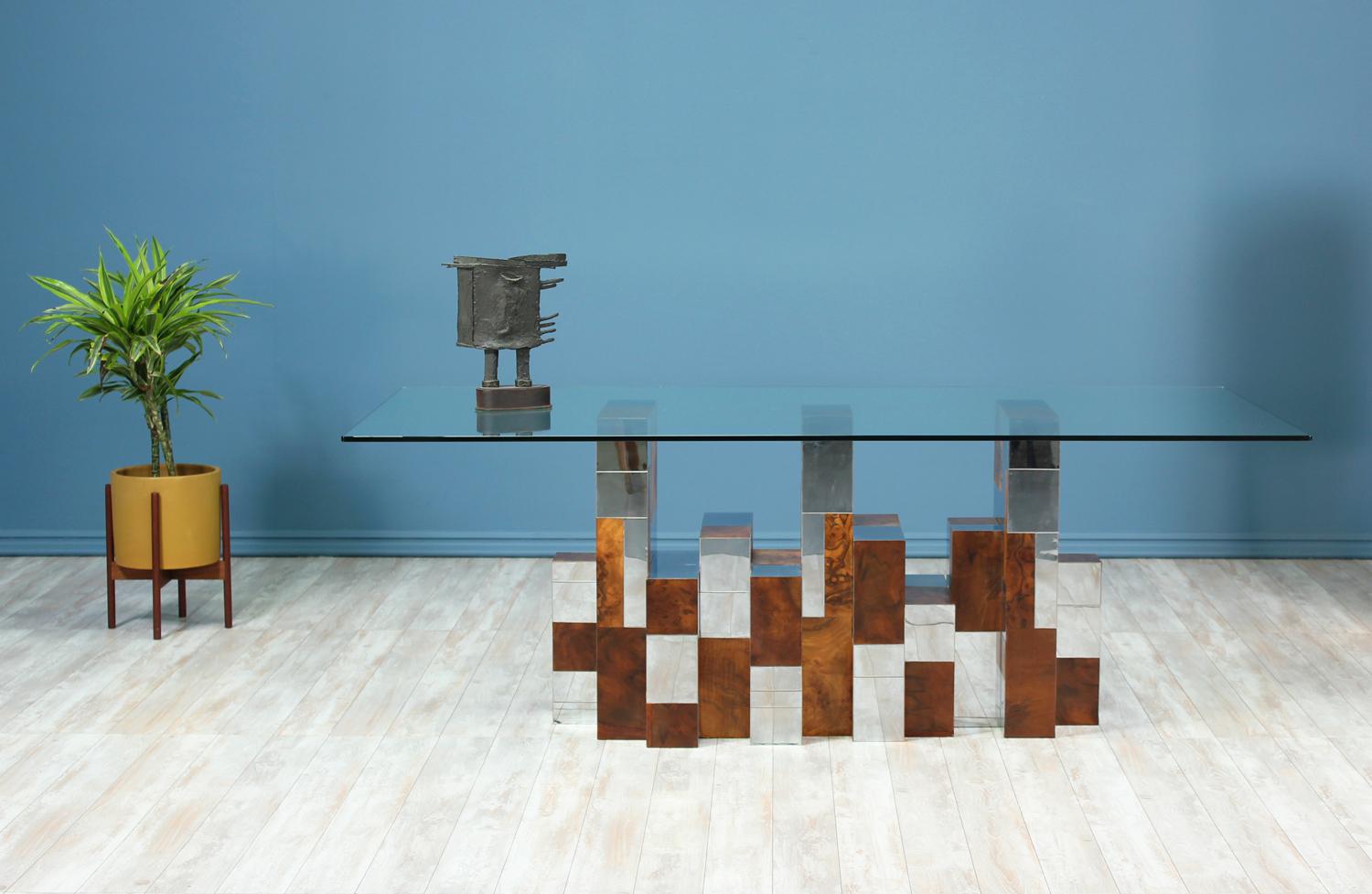 Striking dining table designed by Paul Evans for Directional in the United States circa 1970’s. This sophisticated design is part of the Cityscape series created by Evans and is said to mimic the New York City skyline. The table maintains its