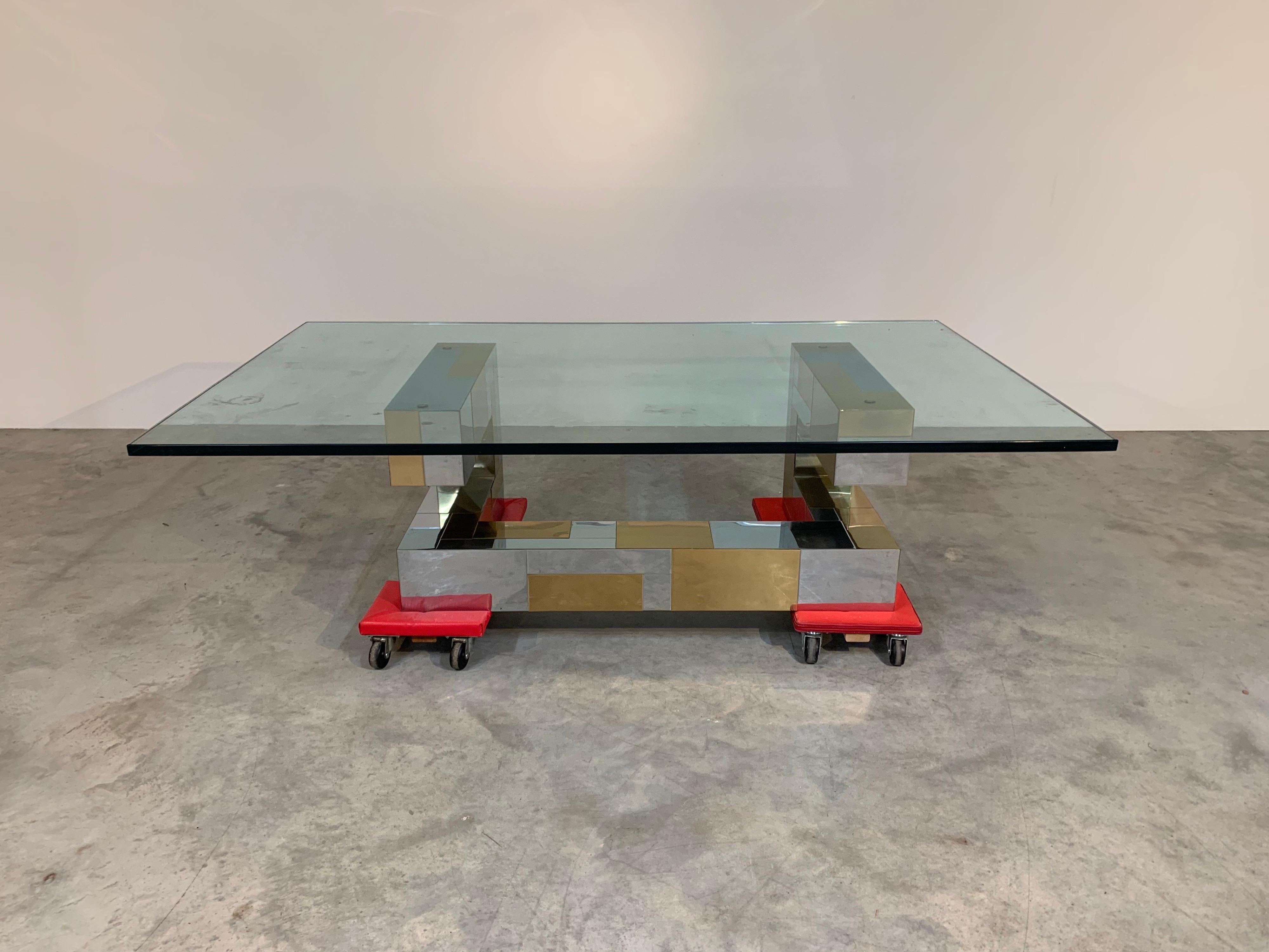 An original Paul Evans Cityscape cocktail table having 3/4” thick tempered glass top. In fabulous original condition. The chromed and brassed steel is clean and scratch free. The glass is also in beautiful condition. Well maintained, circa 1970.