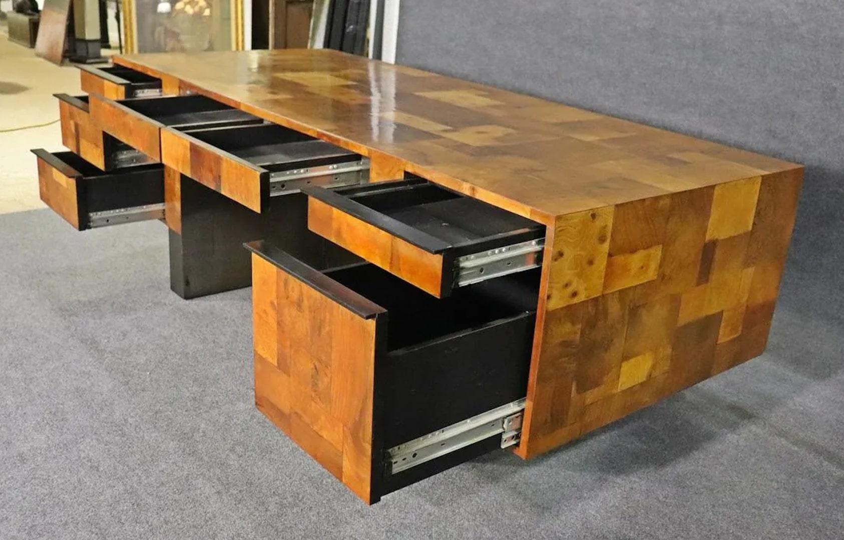 Paul Evans designed executive desk with brilliant burl wood patchwork design. Beautiful piece for home or office, signed by the artist.
Please confirm location.