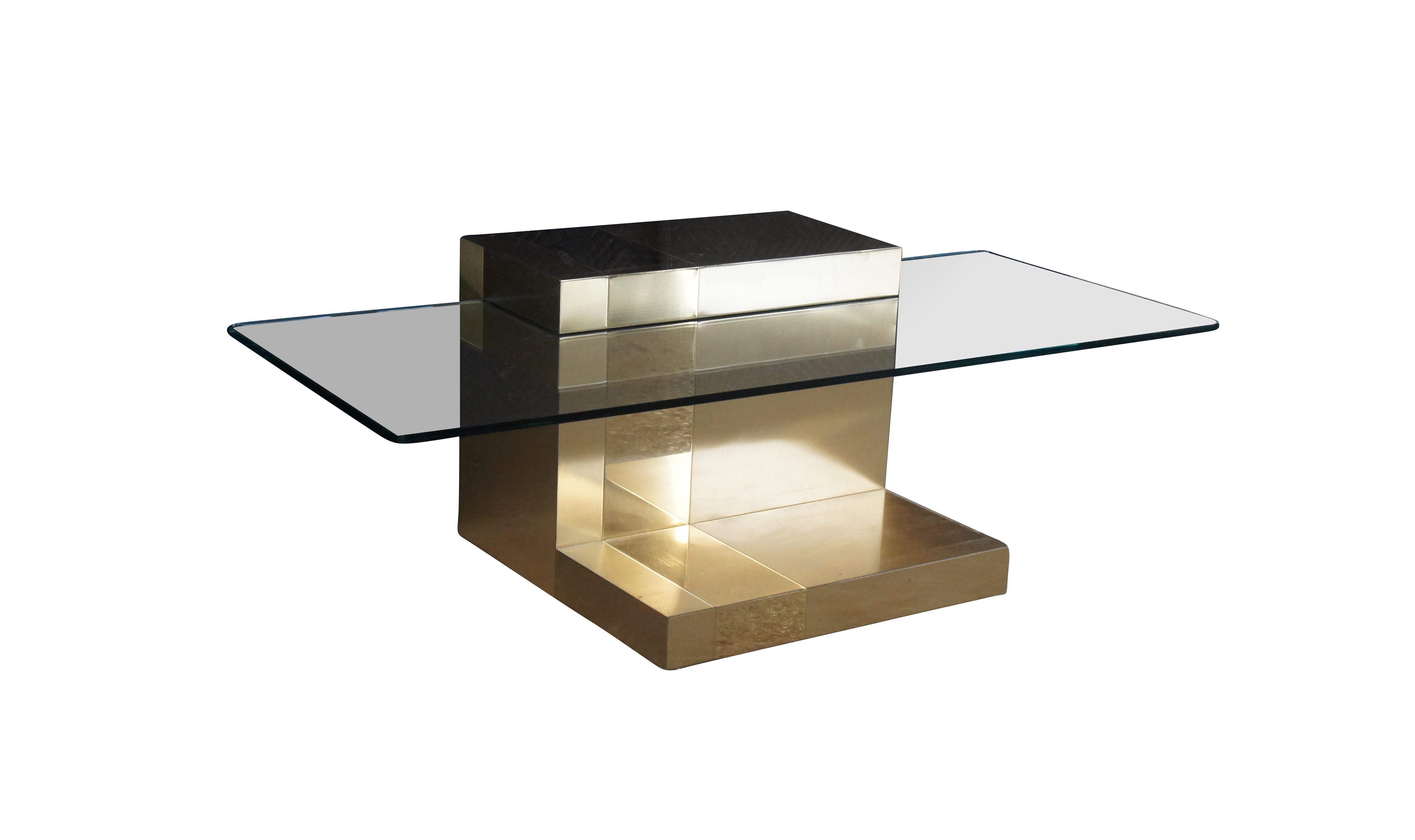 An intriguing Mid Century Modern Floating Cocktail Table by 'Paul Evans'.  Part of the Cityscape Collection, Circa 1970.  The coffee table is made from Polished/Brushed Metal 
Glass with a Cantilever design.  The table could also be repurposed