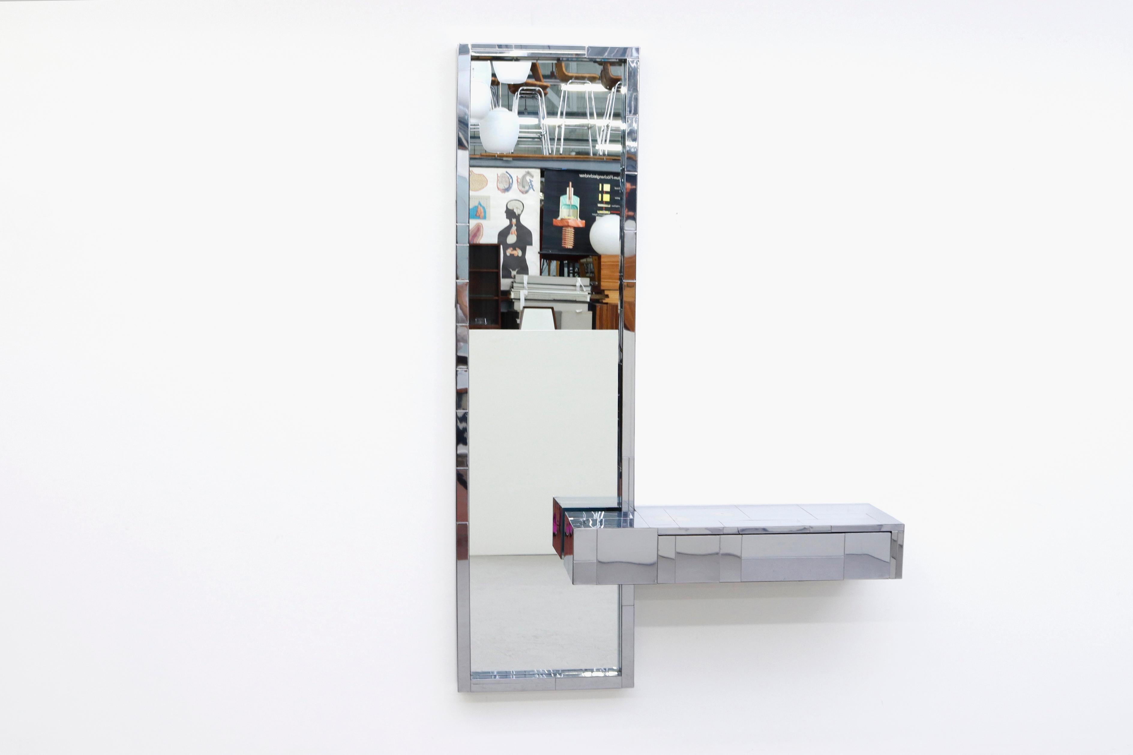Paul Evans cityscape mirror with floating console or vanity. Chrome frame in original condition with some frame wear and scratching. Vanity measures: 36 x 12 x 6. Shown with Pilastro wire stool (LU922415664511) listed separately.