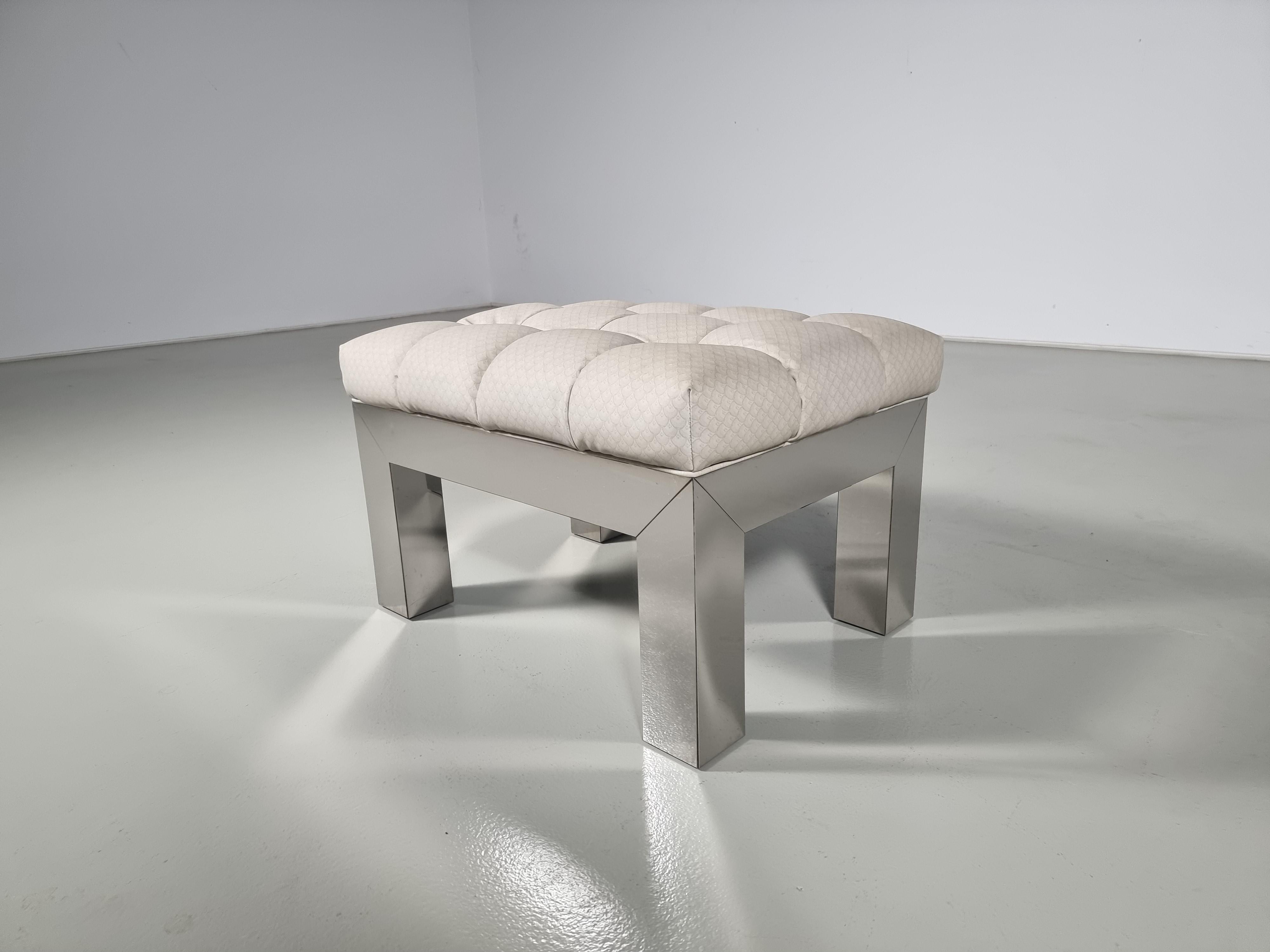 Paul Evans Cityscape chrome ottoman. USA, Circa 1970. 

A Paul Evans ottoman/stool in classic chromed steel veneer. The Cityscape line was designed and produced by the Evans Studio in New Hope. It still has the original upholstery. On request, we