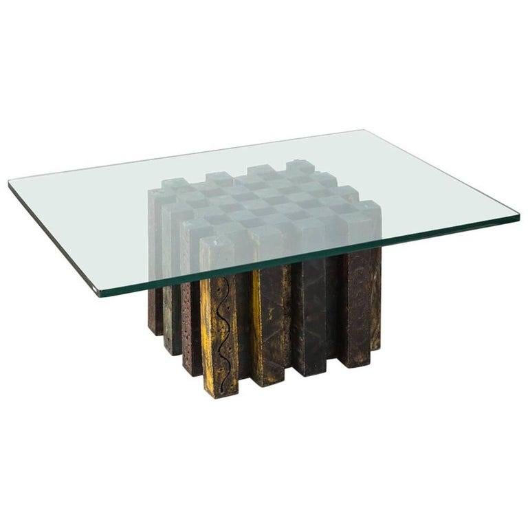 This unique table was originally designed as a chess table in his infamous touch cut and welded technique. Topped with tempered glass, this table works as a functional piece of striking design.

Medium: Torch-cut, welded, and polychromed steel,