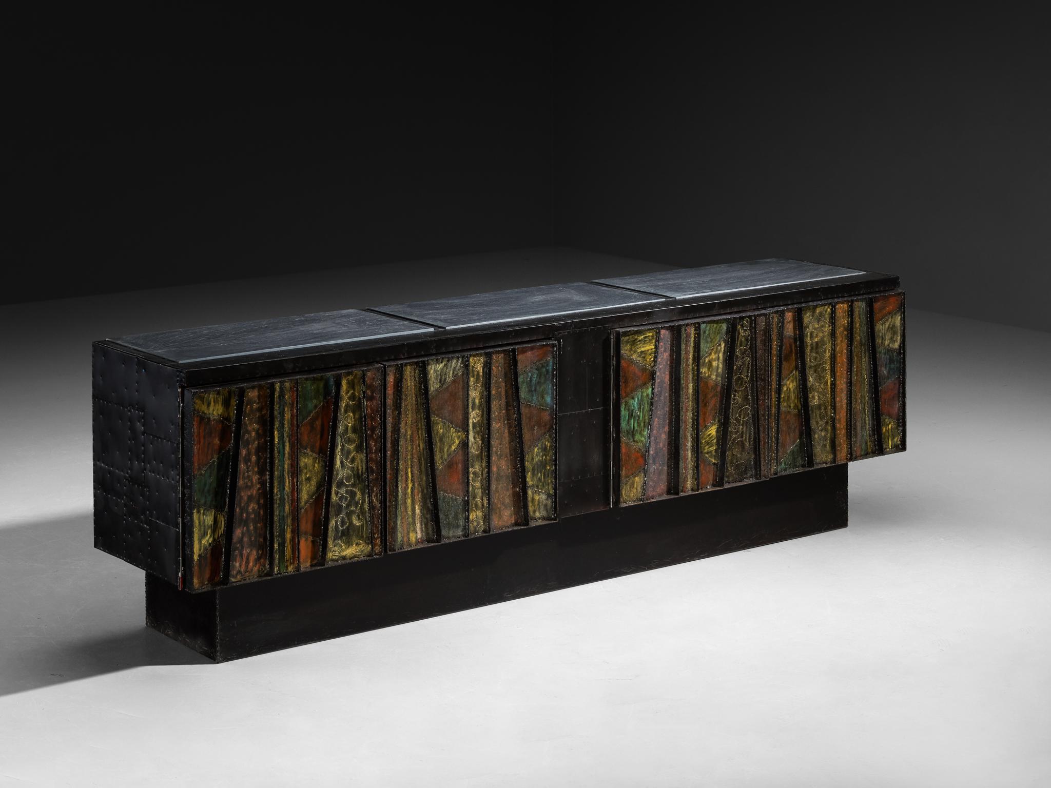 Paul Evans, Paul Evans Studio for Directional, 'Deep Relief' sideboard, model 'PE-42', welded steel, enameled patchwork steel, painted oak, cleft slate, United States, 1968

An exceptional design by Paul Evans undeniably breathes artistic excellence
